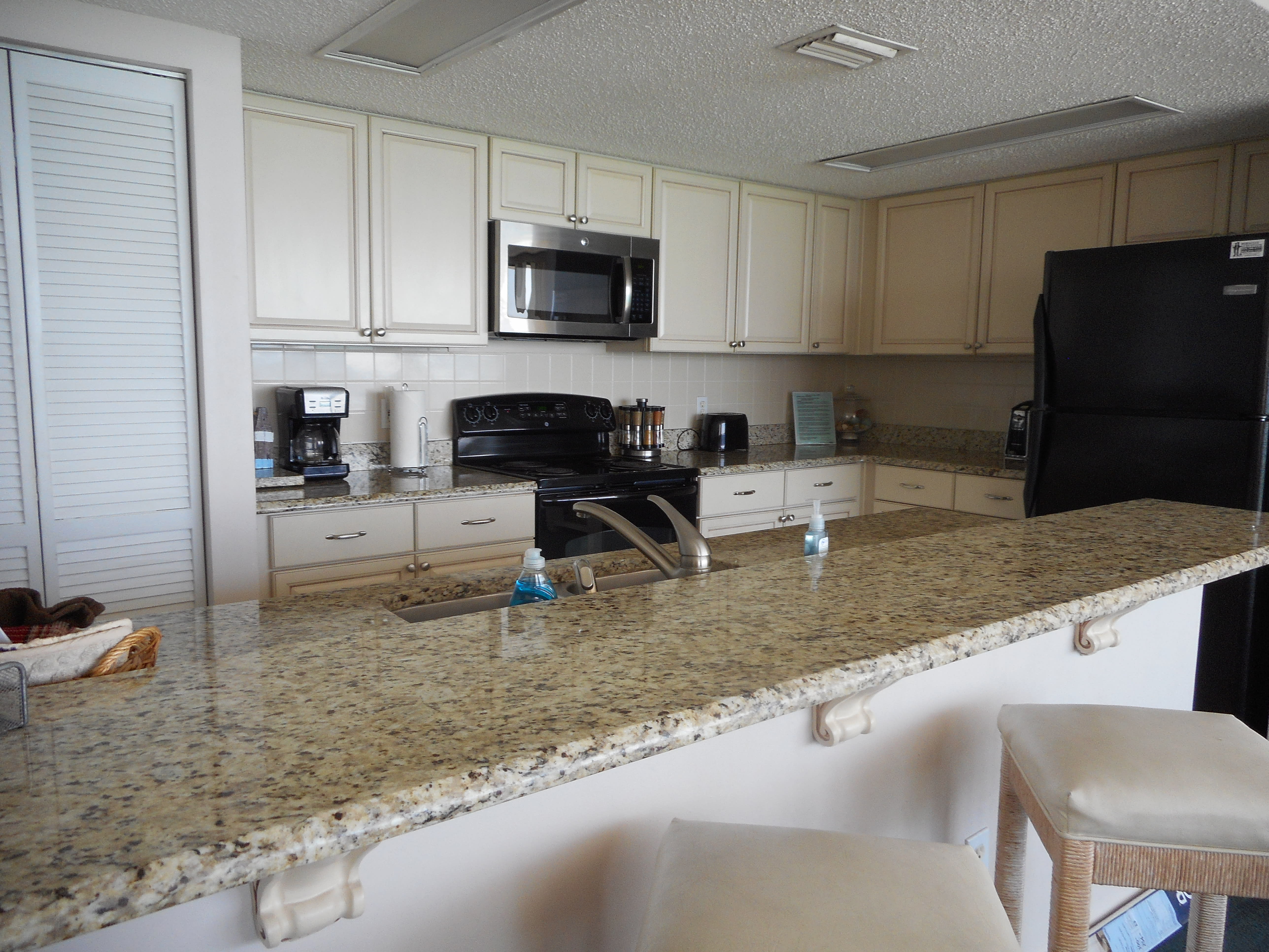 BAR STOOLS AND GRANITE COUNTER FOR EXTRA SEATING