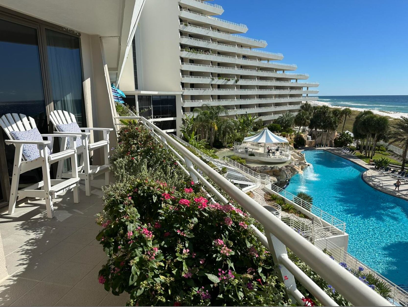 East View of Waterfall Pool &amp; Flower Planters. 