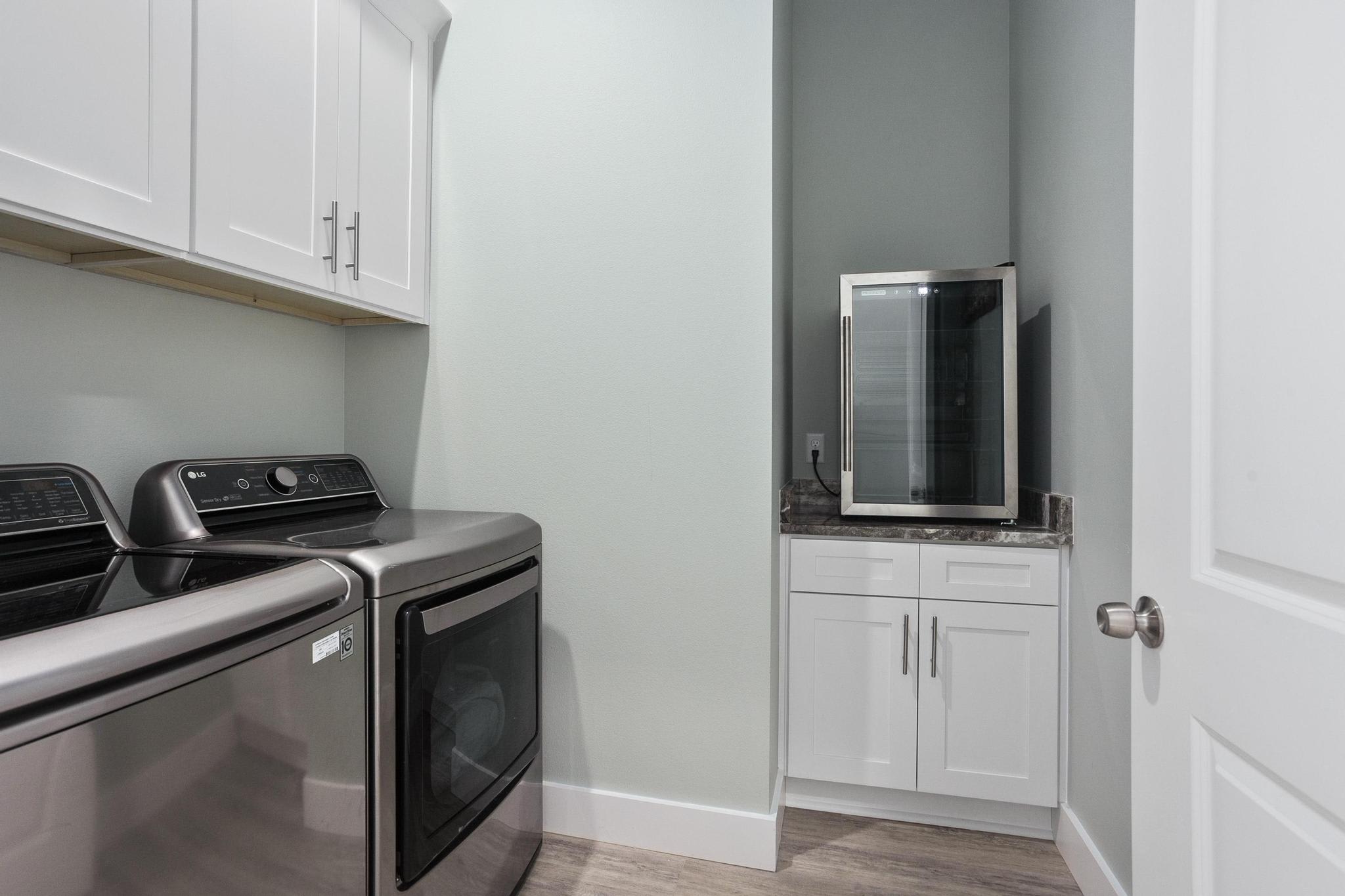 Laundry area with wine cooler