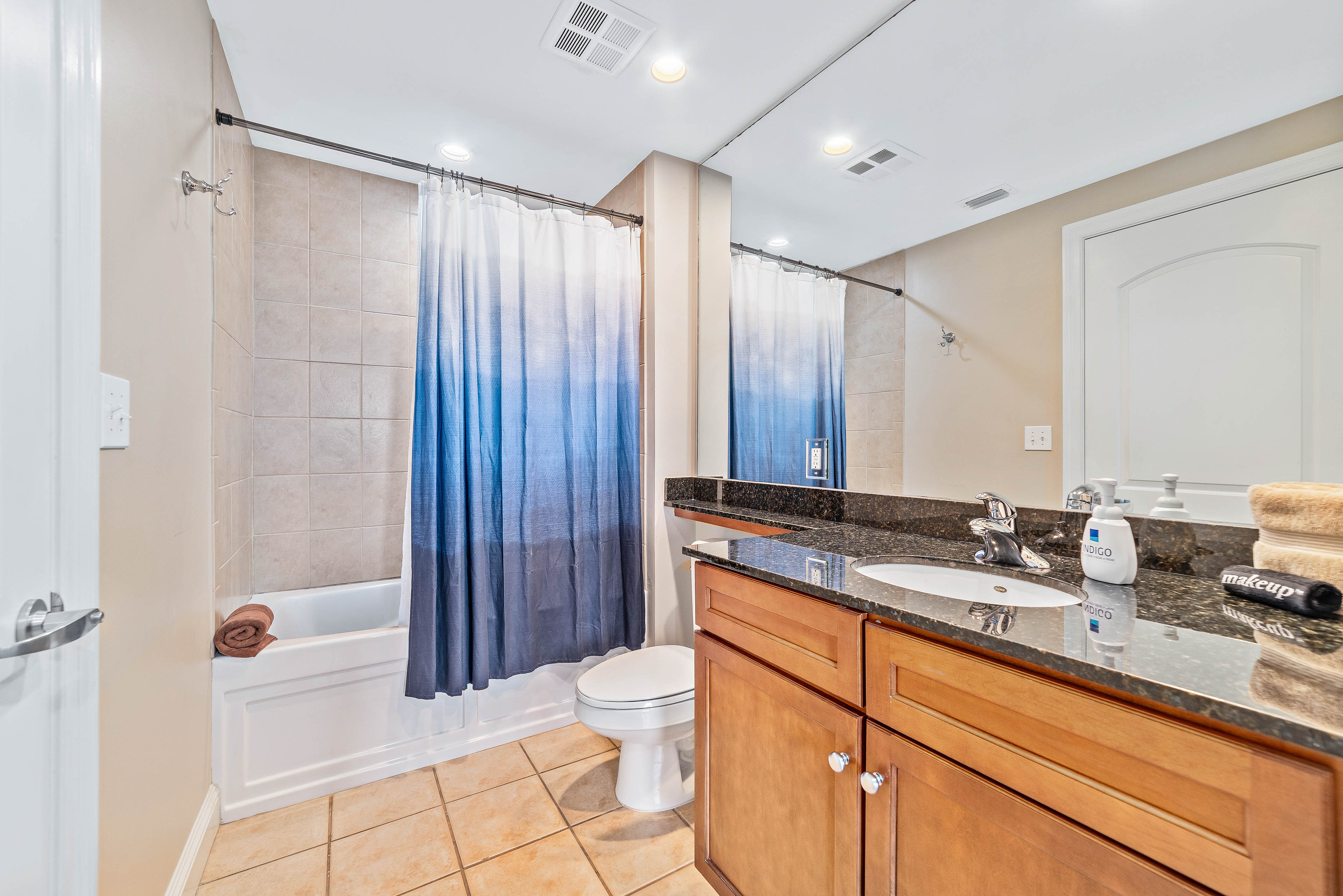 The second bathroom can be accessed from the hallway or the guest room alike