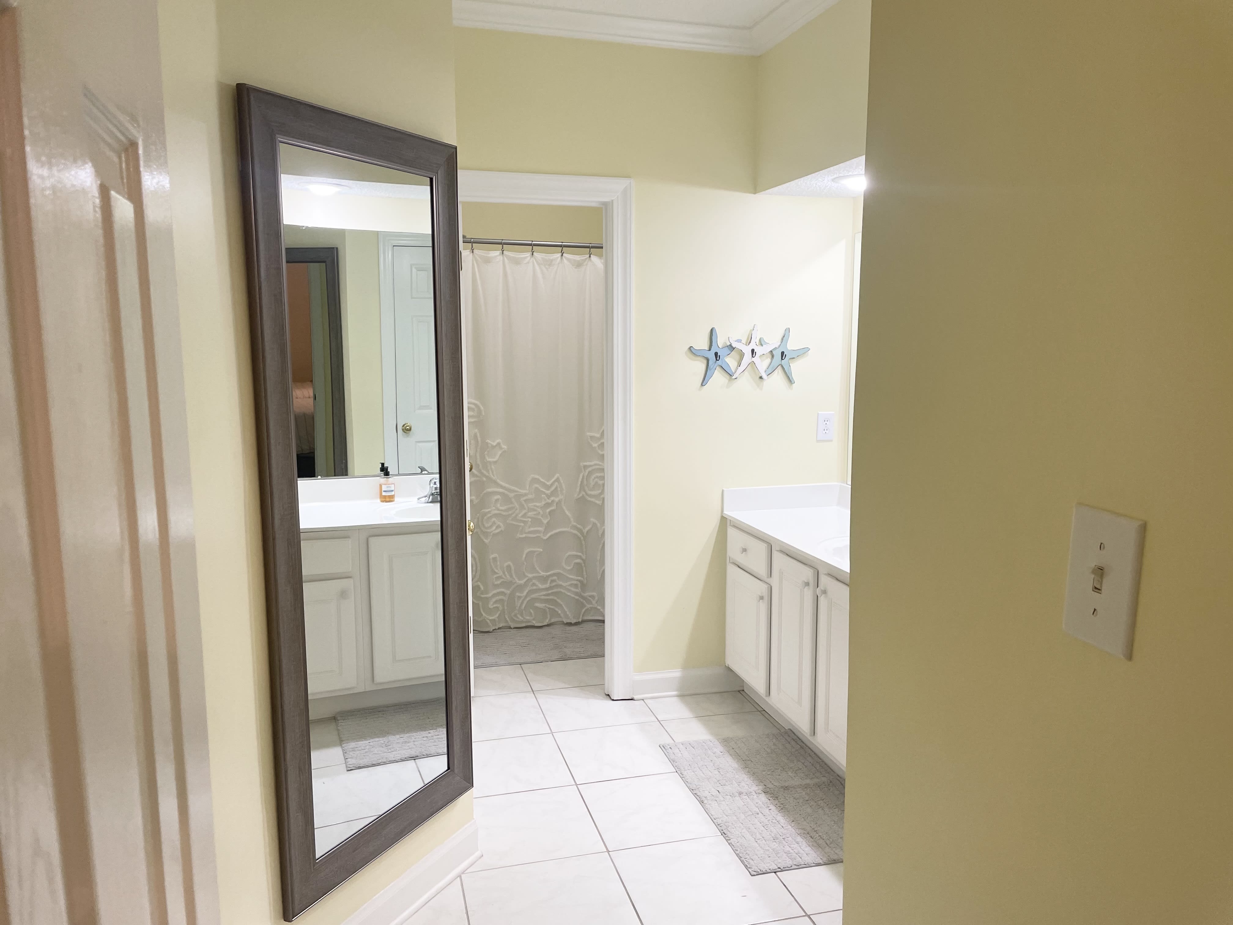 YELLOW GUEST BATHROOM WITH LINEN CLOSET &amp; WALK IN CLOSET 