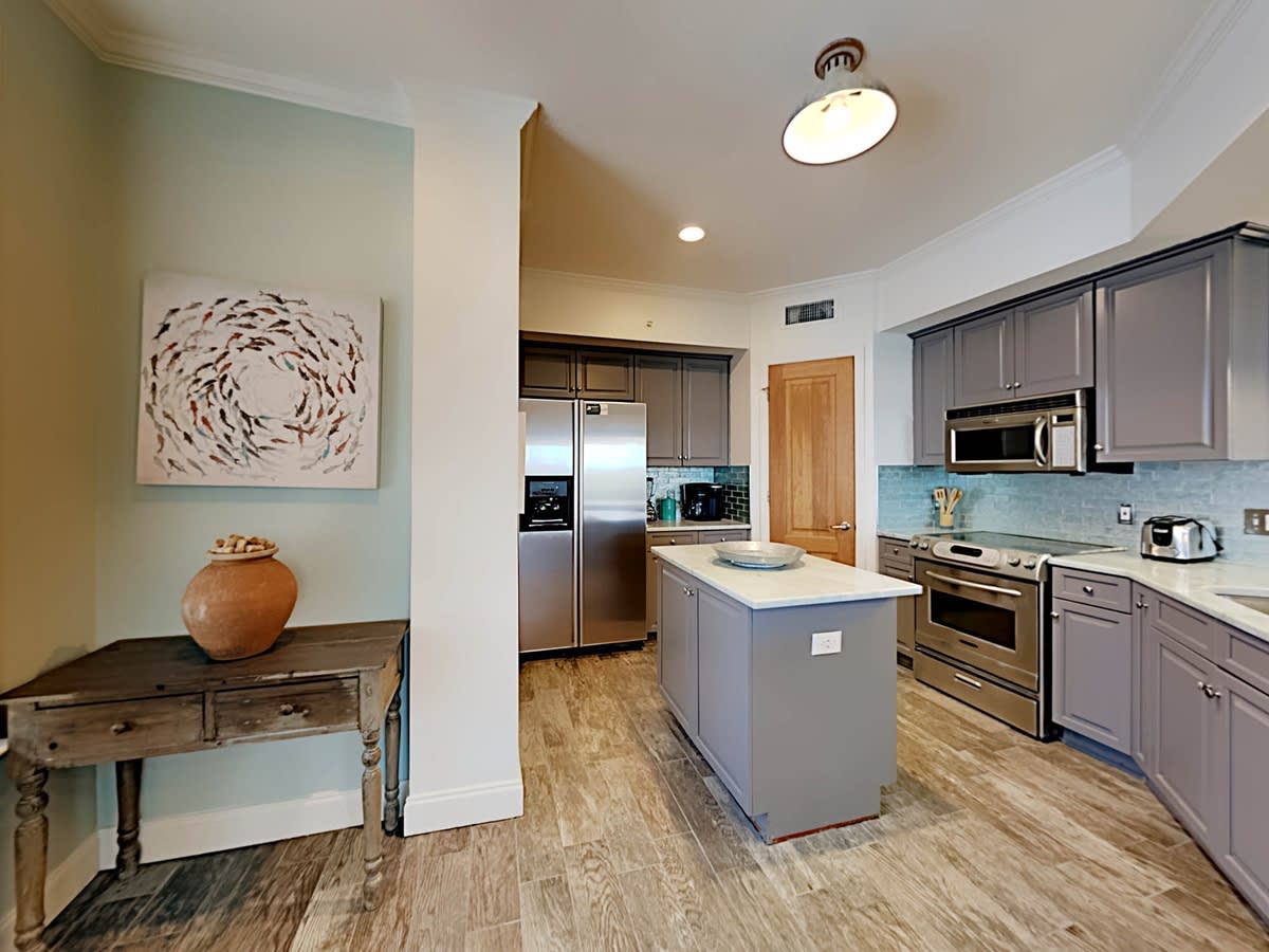 Well appointed kitchen, stainless appliance, pantry, new dishes and cookware.