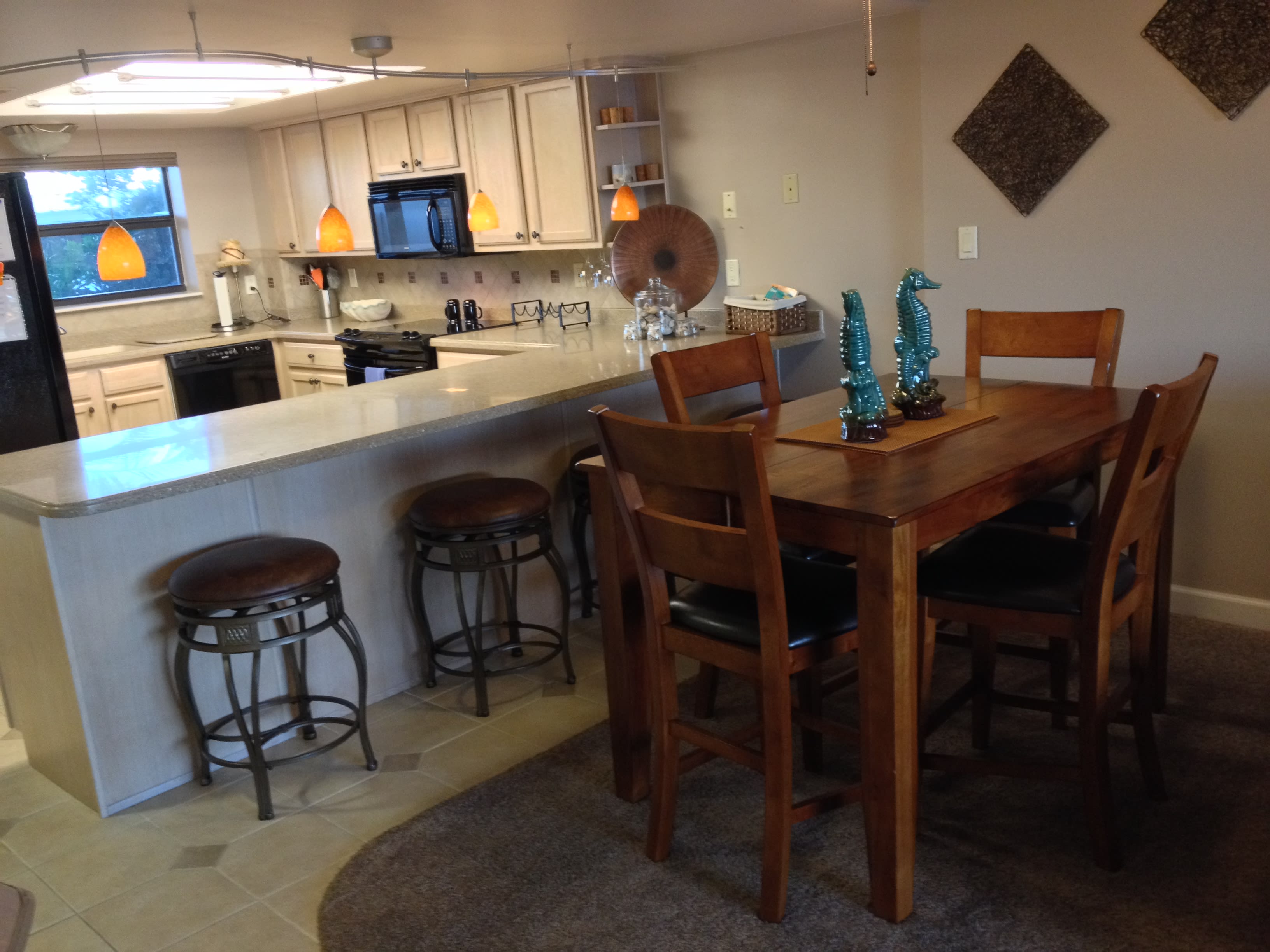 Dining table can comfortably seat 6-8, just add the leaf &amp; bar stools