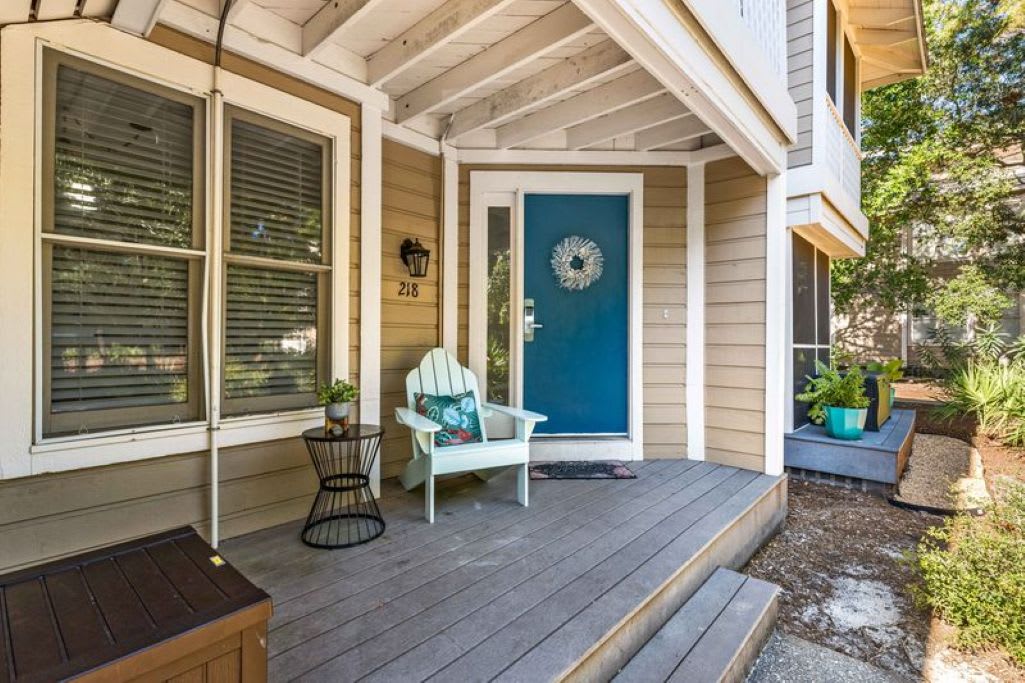 Lower level unit-Beach toys on front porch, locked equipment on side porch