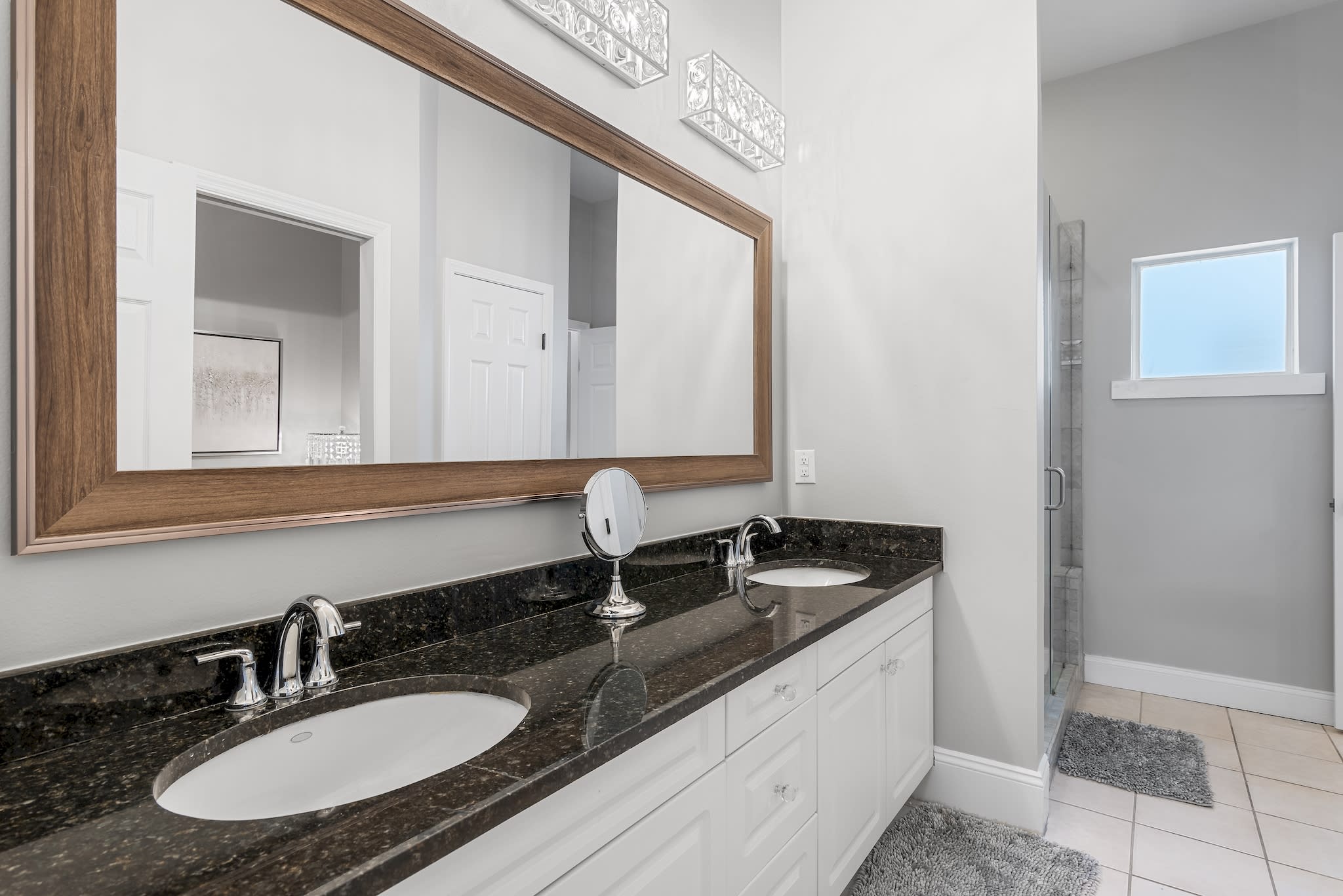 Master en suite bathroom, twin vanity, walk-in shower, accessible from Liv Rm