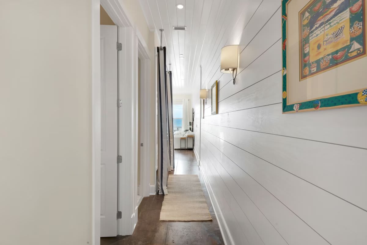 Hallway with beautiful beachfront views and two bunks located here with lights