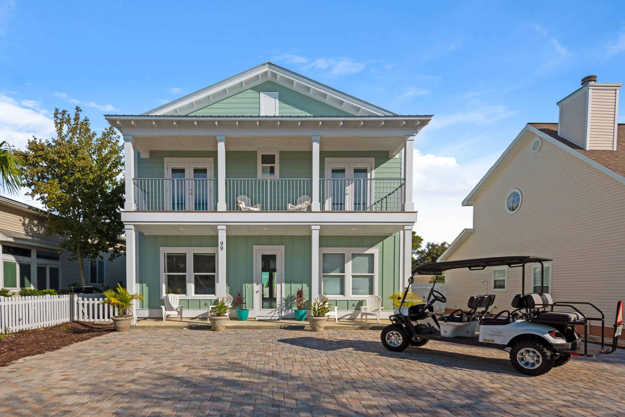 Front porch with large  parking area. Golf cart available for rent