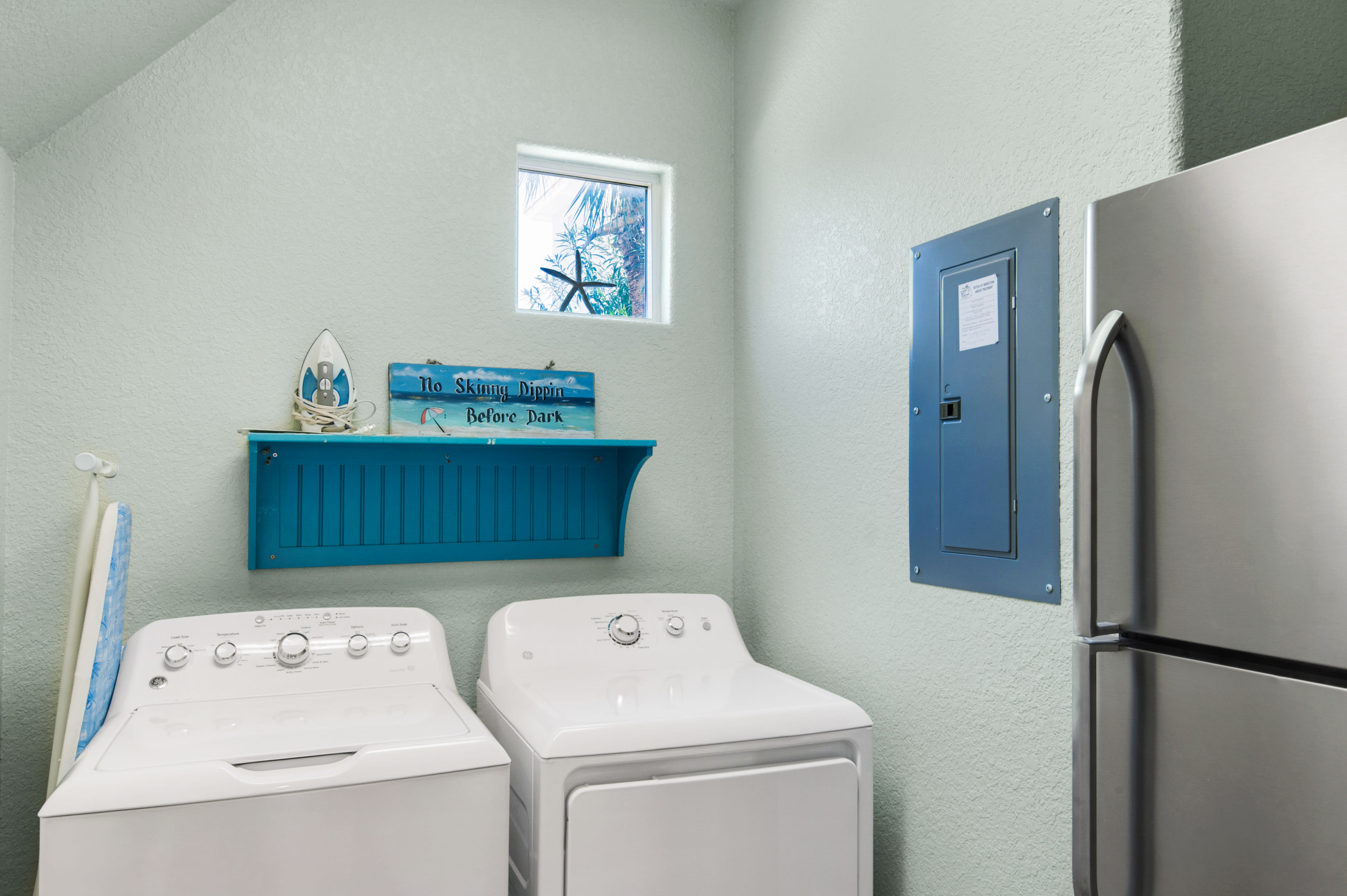 Laundry Room with extra refrigerator.