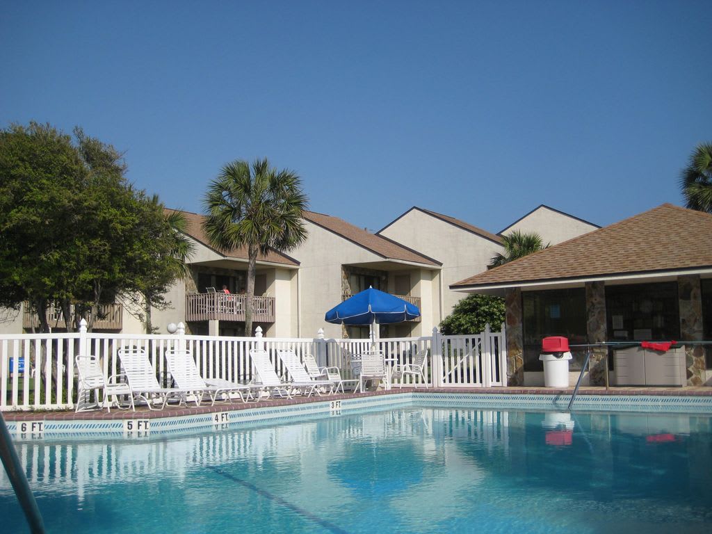 Great pool surrounded by a lush and landscaped yard.  Pool heated in the winter!