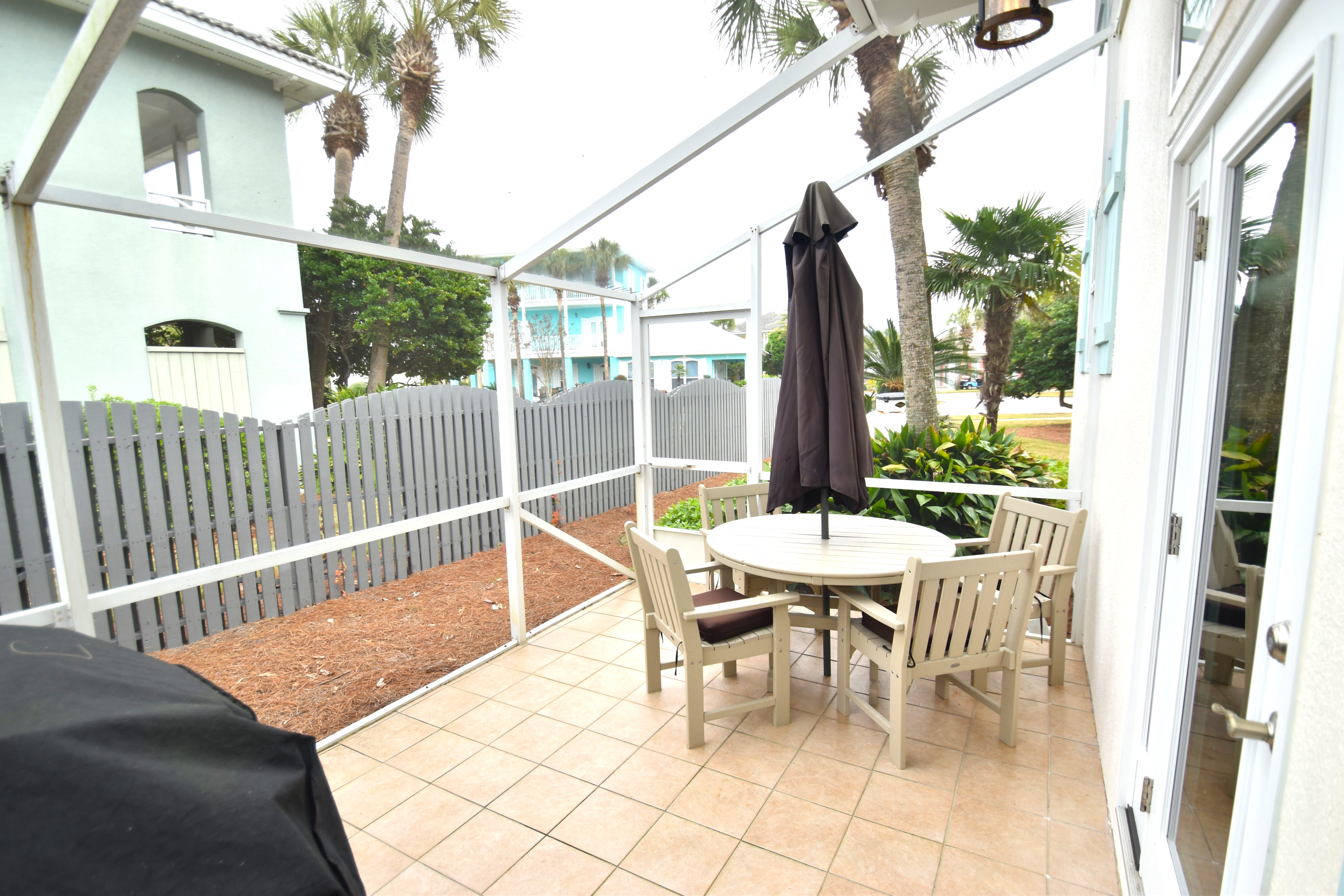 Enjoy some of your favorite grilled foods on the shaded, screened in back porch