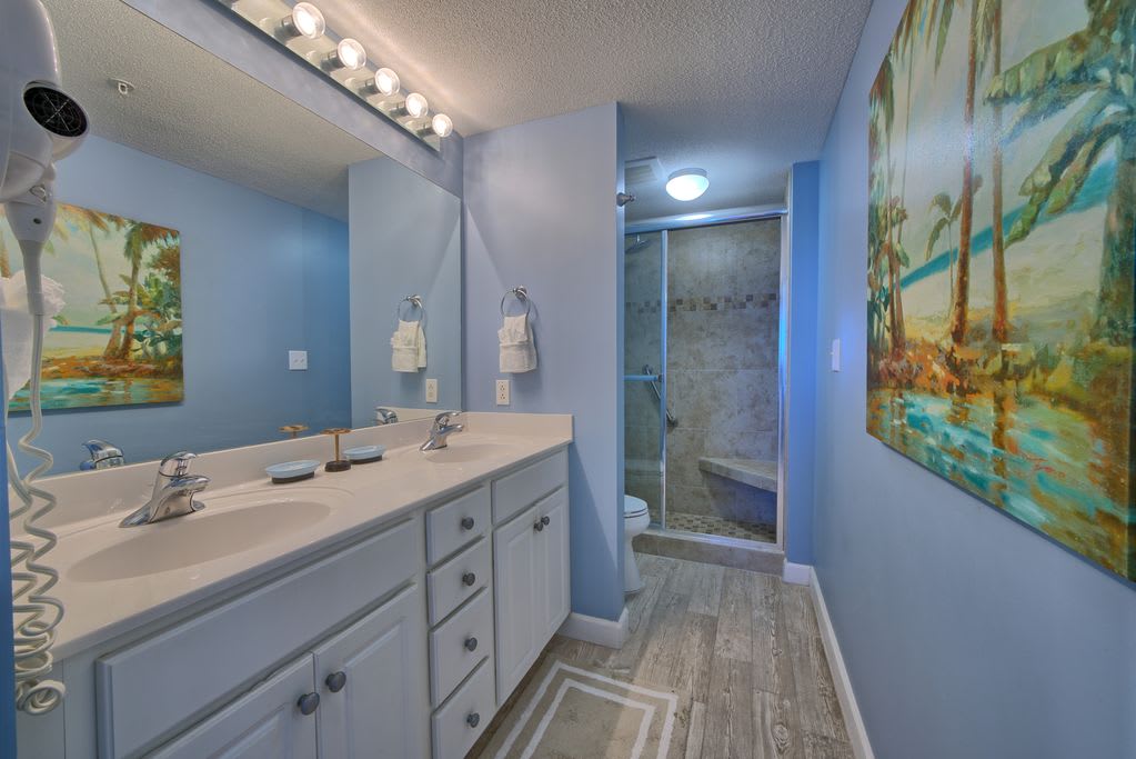 Private master bath with walk in tile shower.