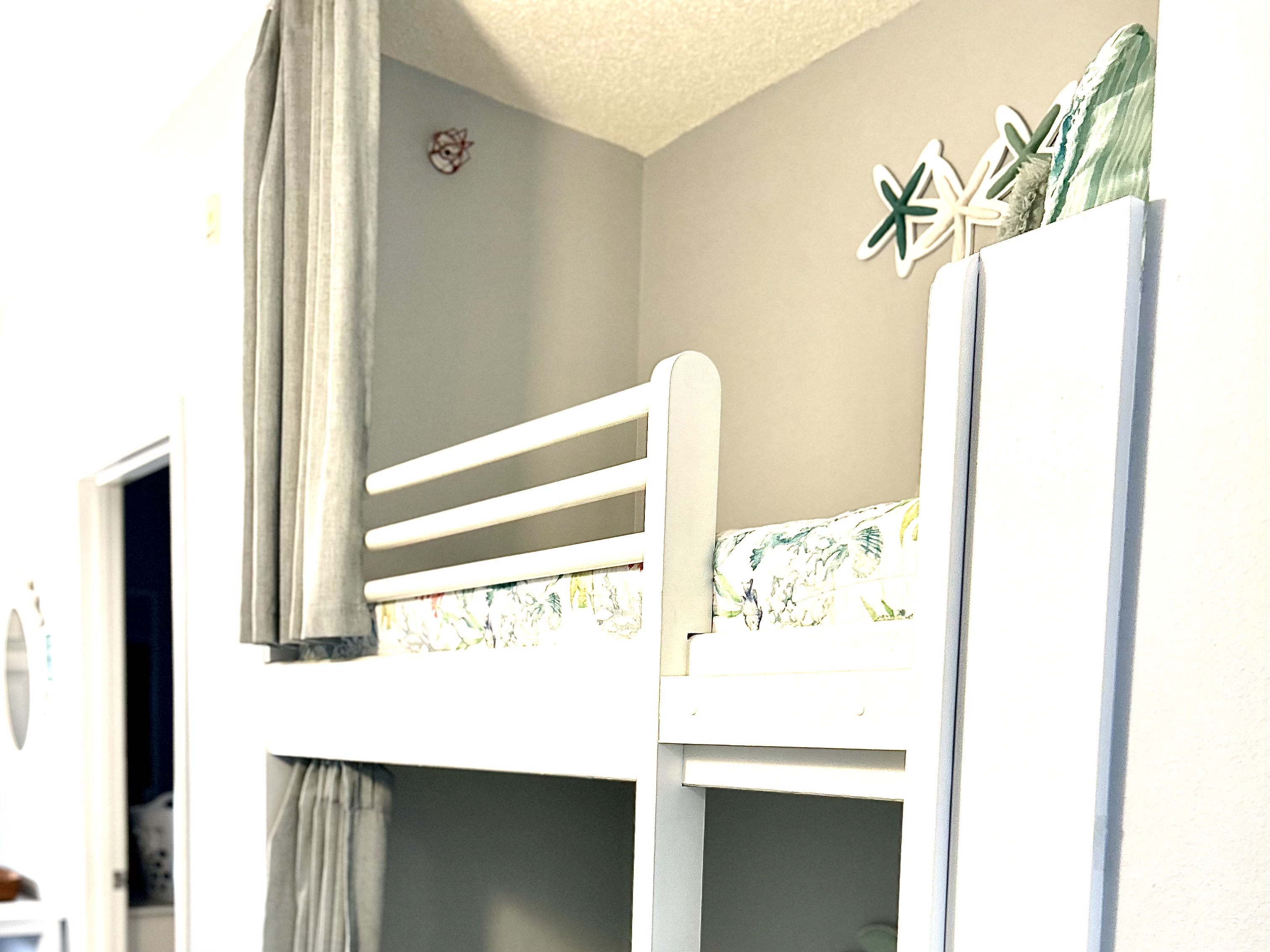 Bunk bed also has privacy curtains.