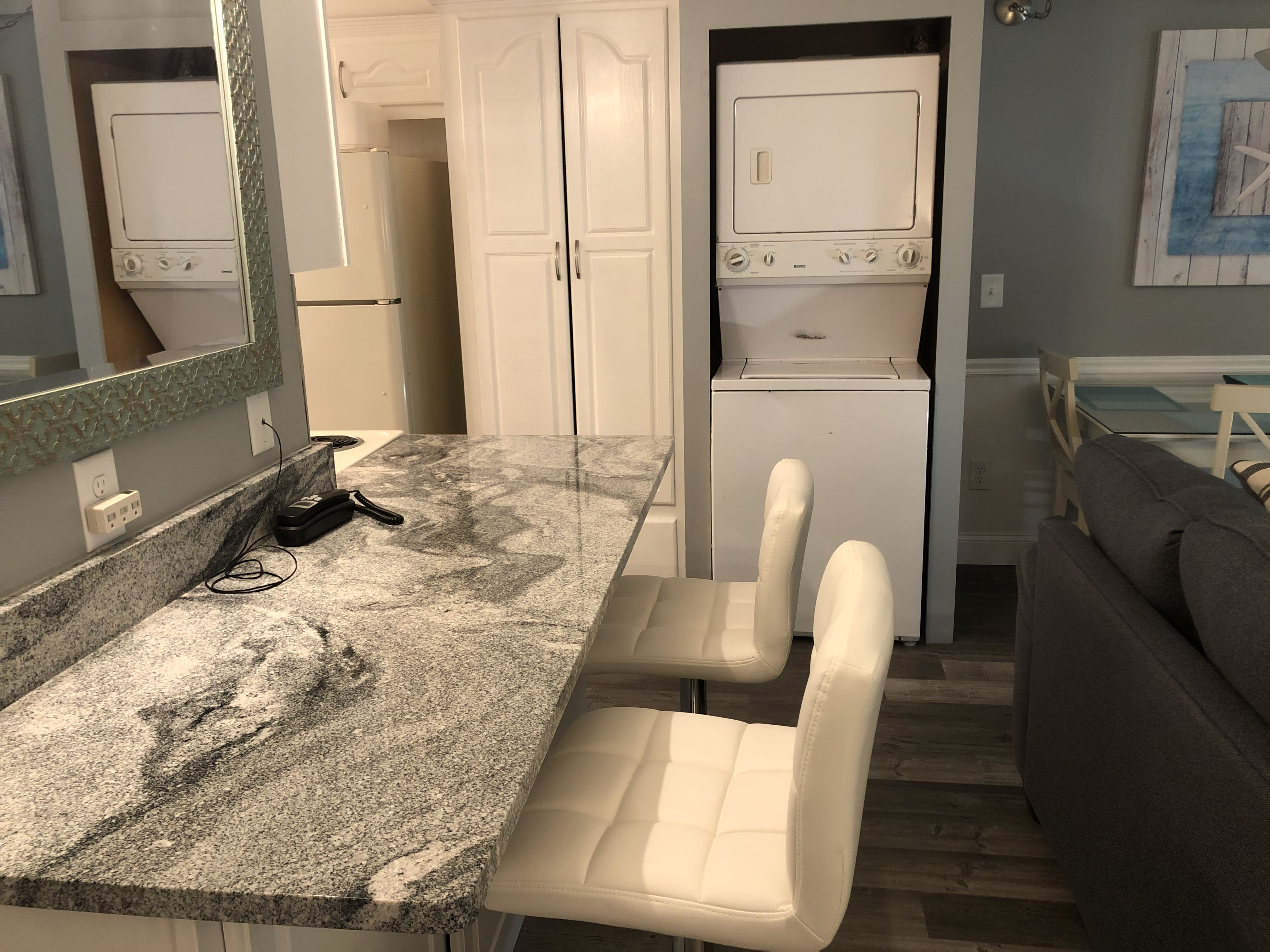 Bar area with washer and dryer.