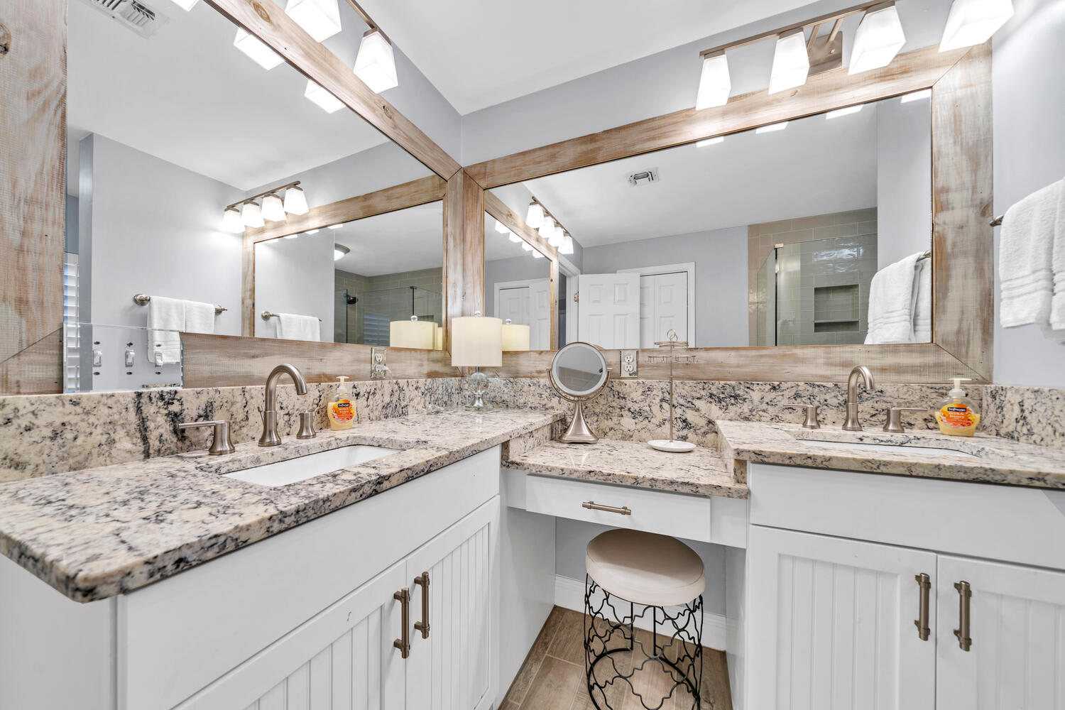 Recently renovated primary bath with double sinks and knee space