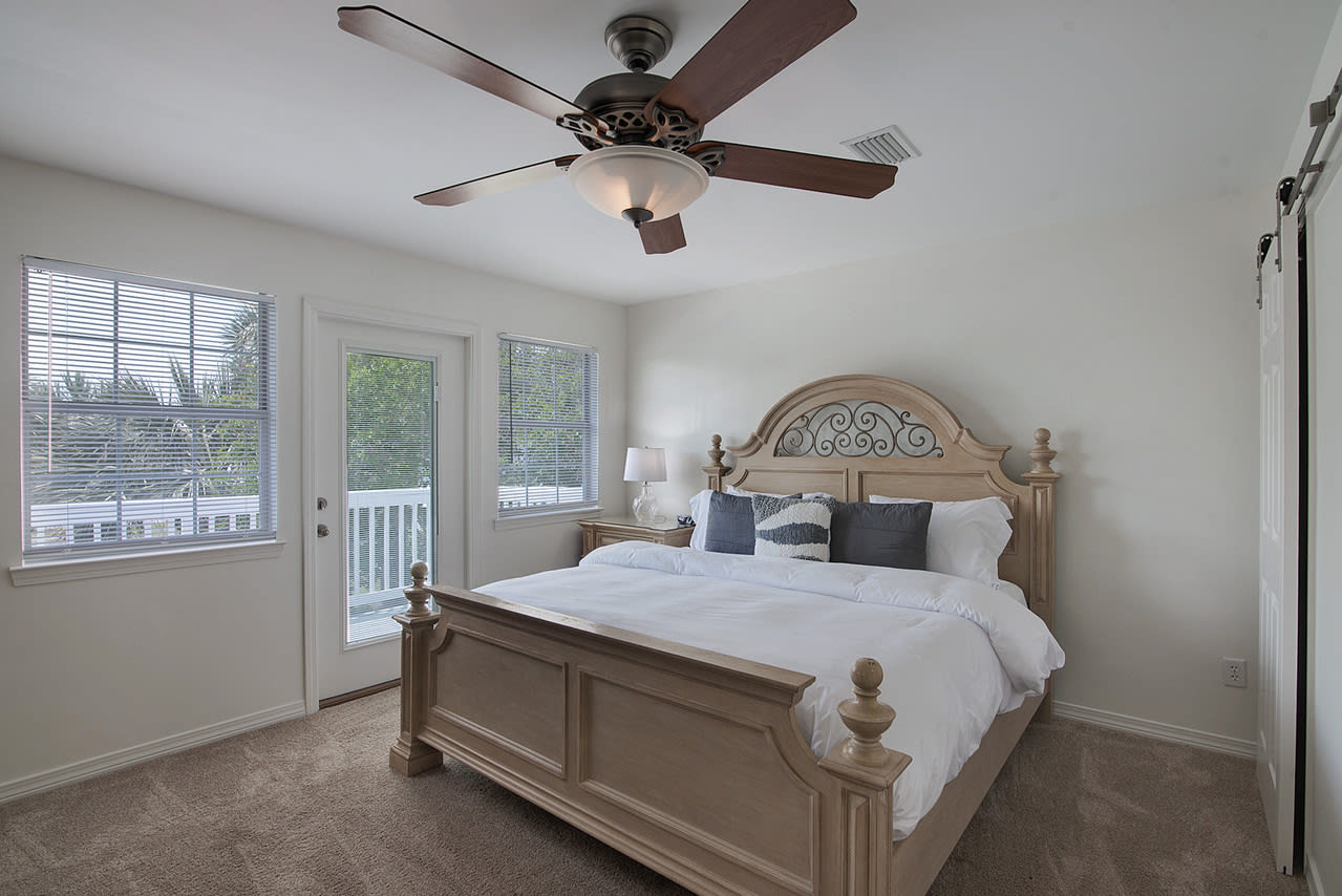 Spacious upper level king bedroom with private patio.
