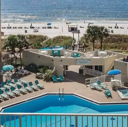 Pool deck steps away from the beach!