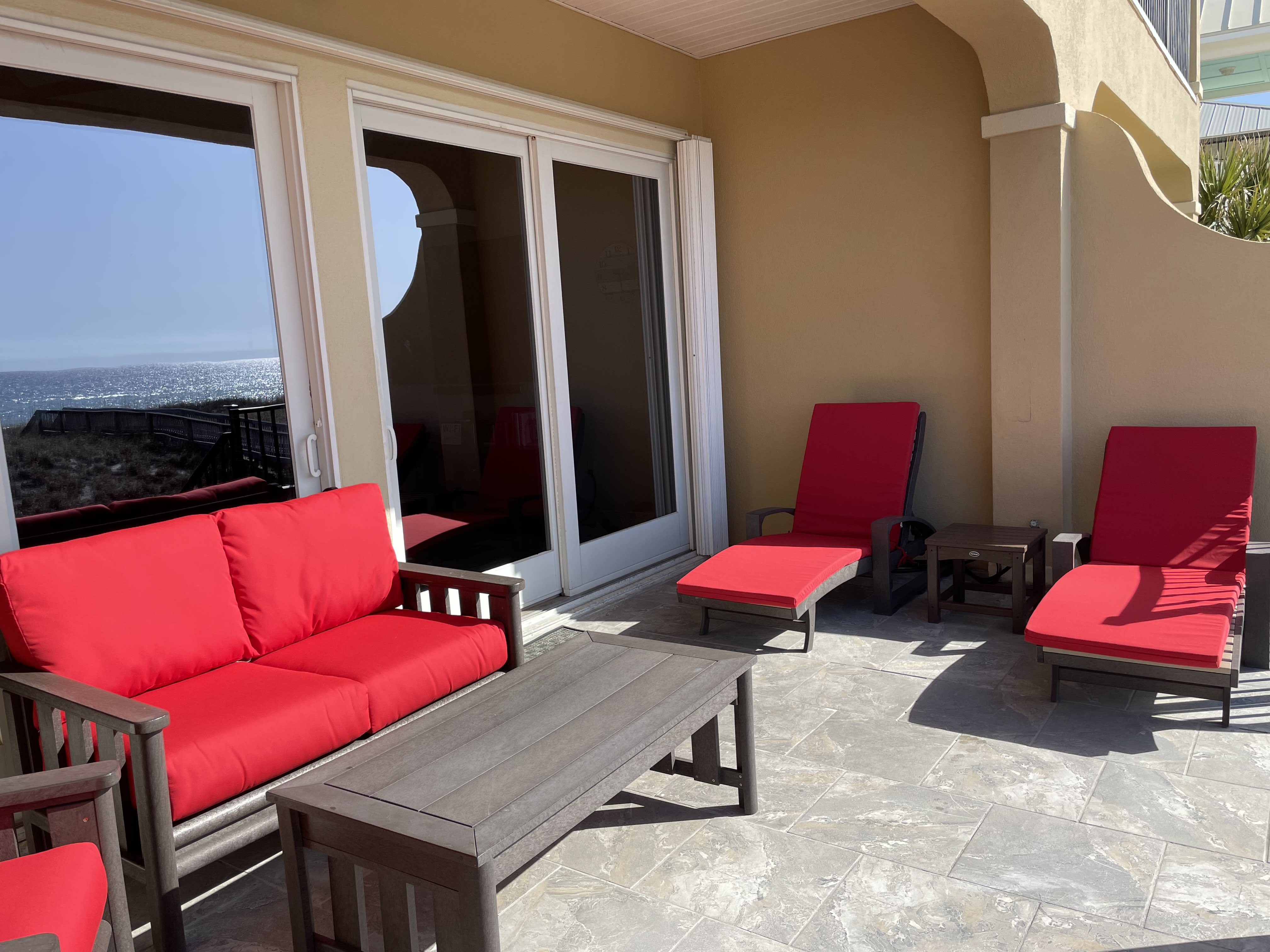 Two loungers, a love seat and two chairs available on the deck with ocean views.