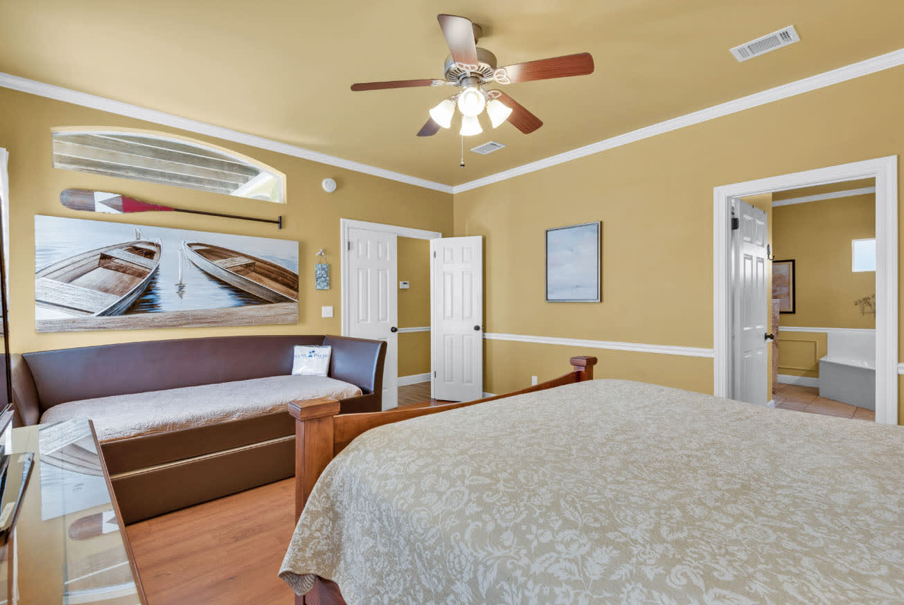 Master bedroom with King size bed, day bed, and a pull-out trundle bed.