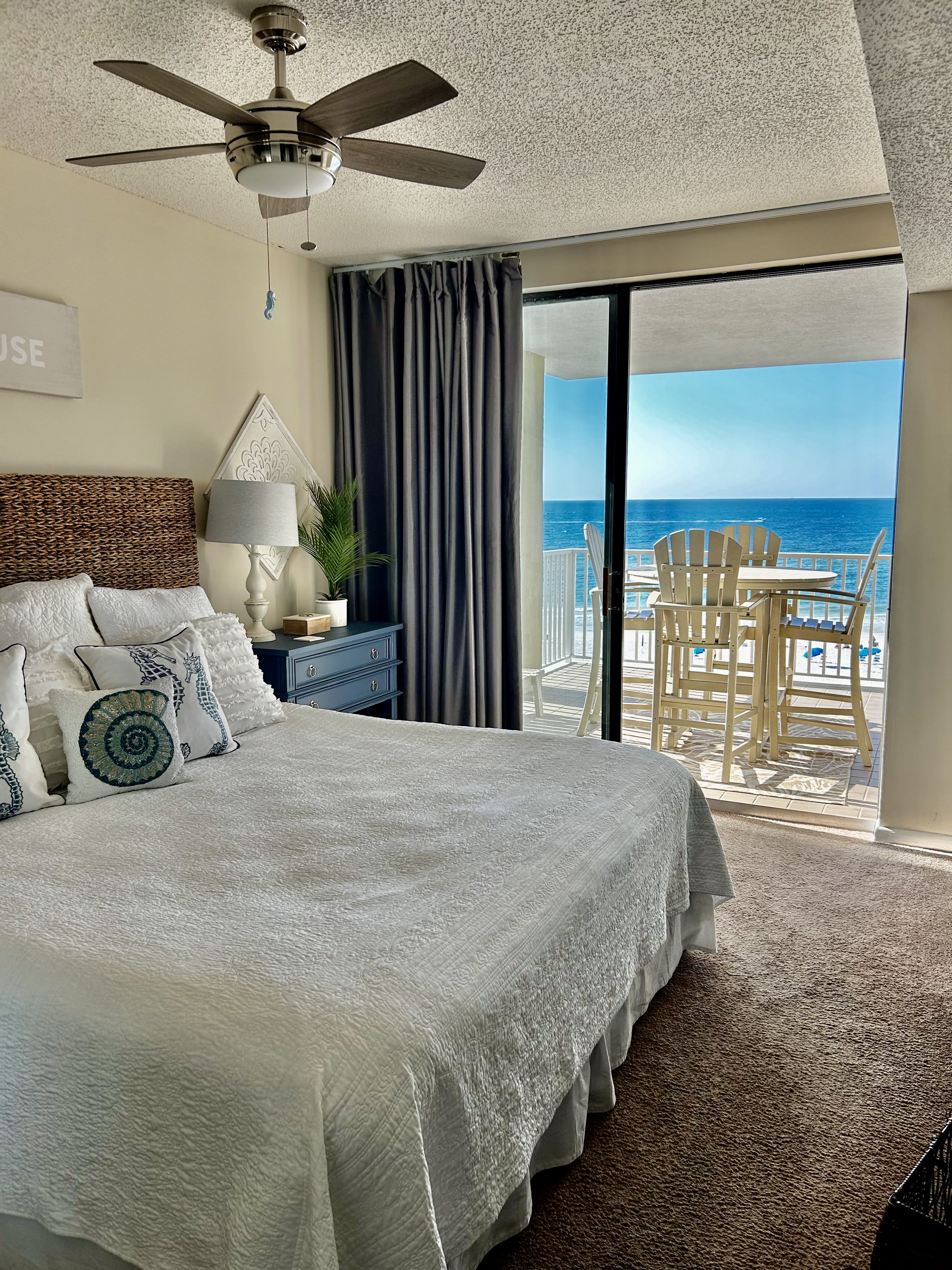 Master Bedroom King Bed with Sliding Glass doors to balcony and smart tv