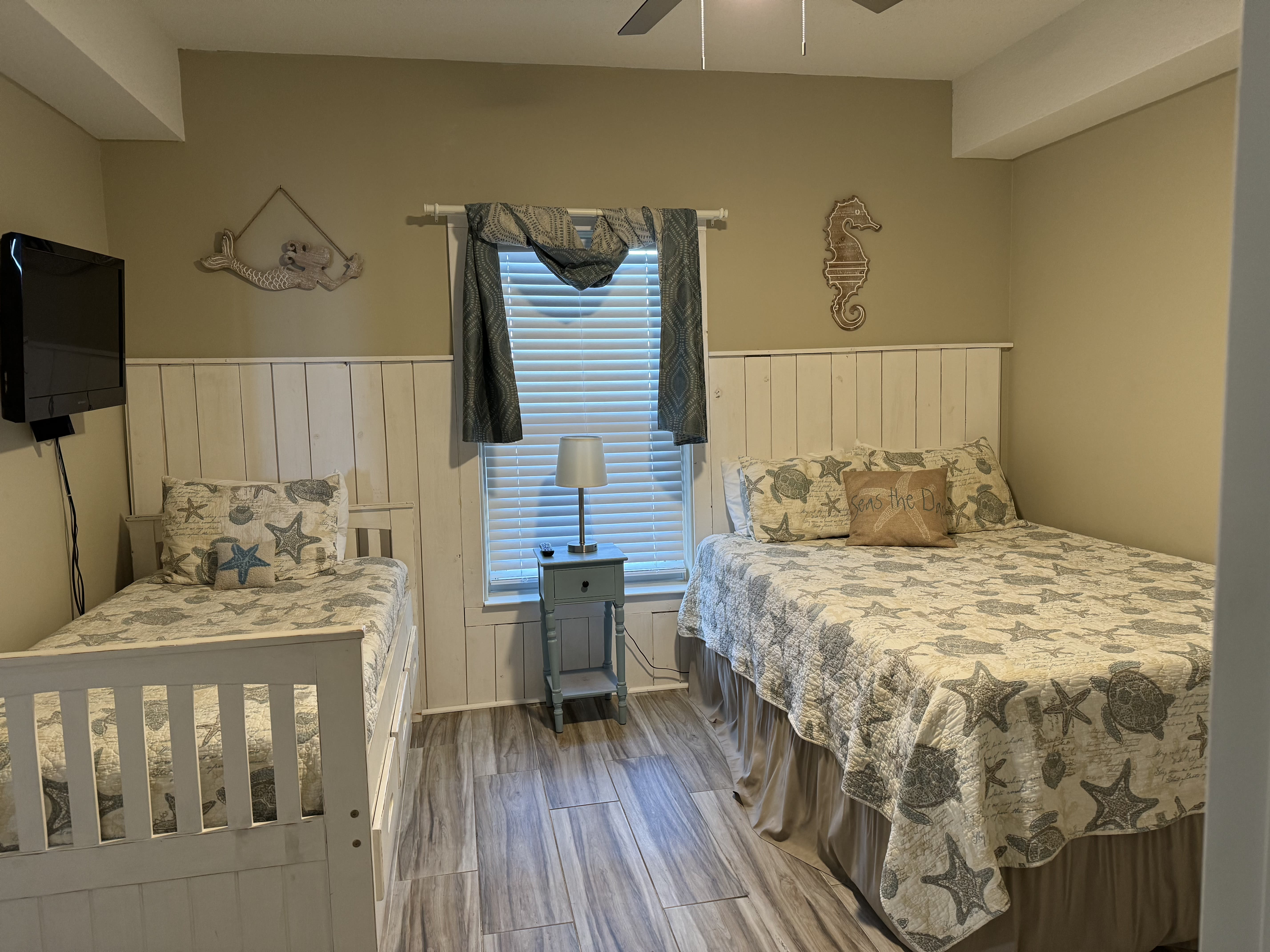 Second bedroom has a queen size bed and a trundle bed.