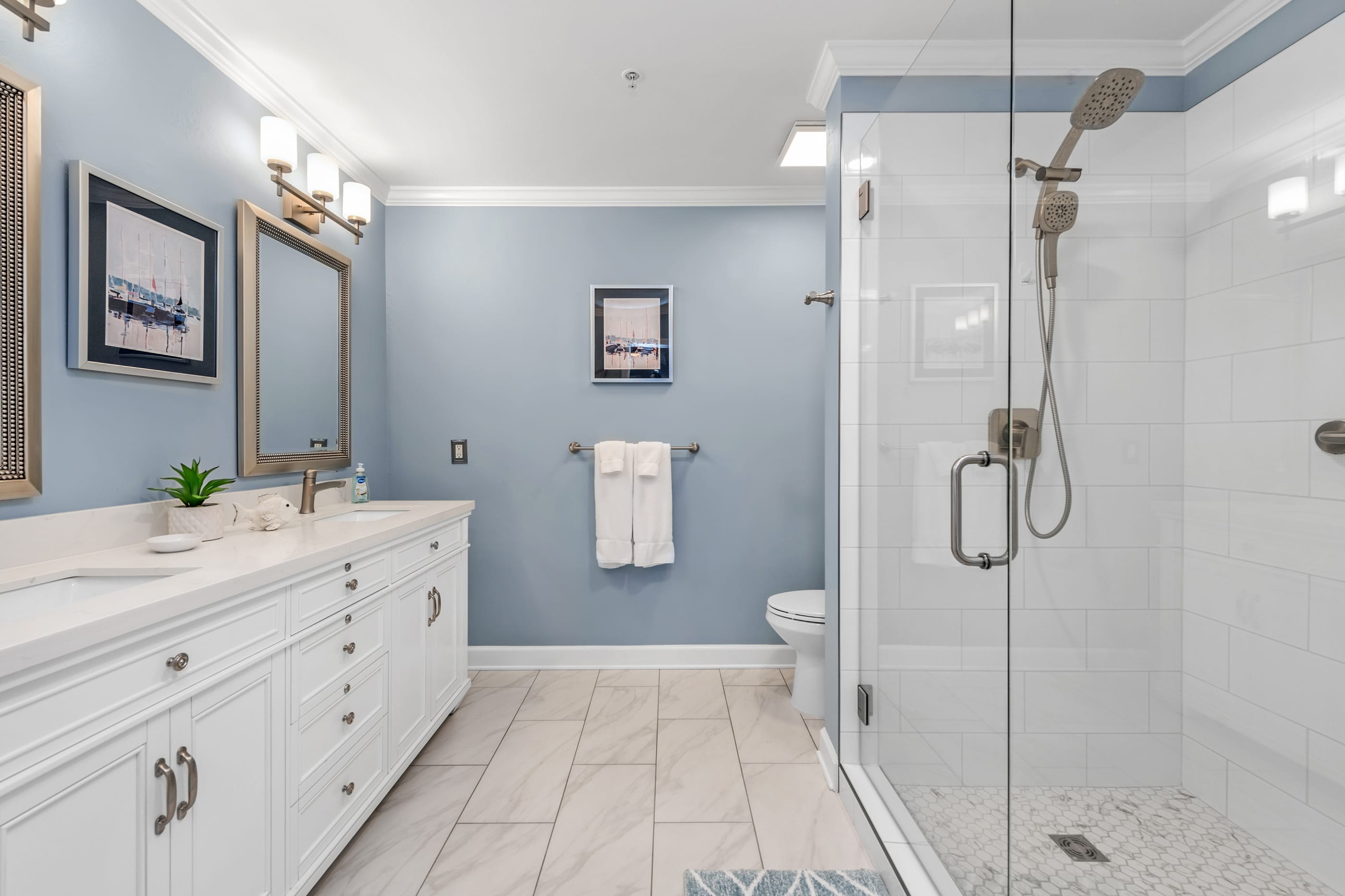 Spacious and Luxurious Master Bath with double sinks and large vanity mirrors.
