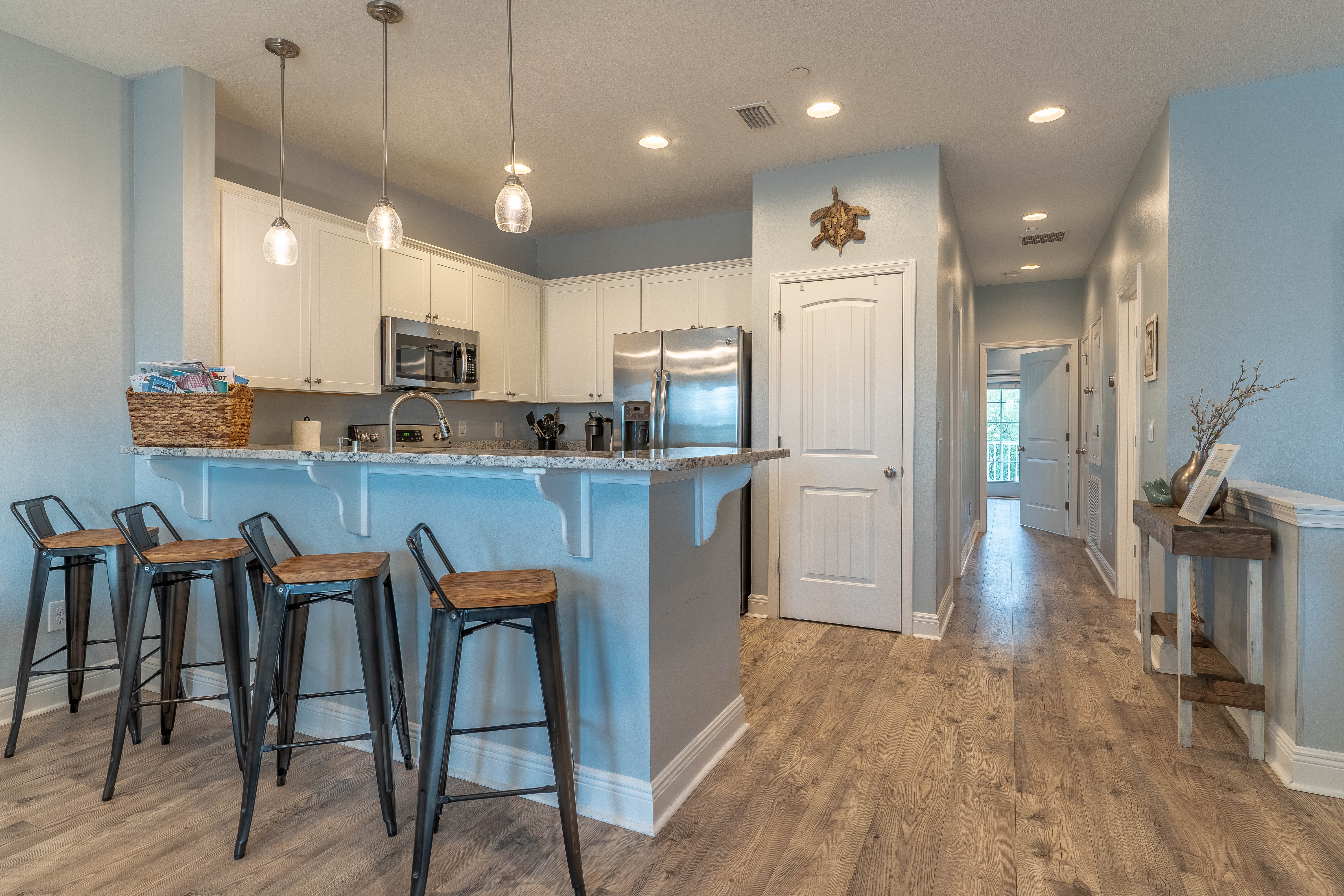 Full kitchen with seats for 4 at the bar and dining for 6. Highchair included