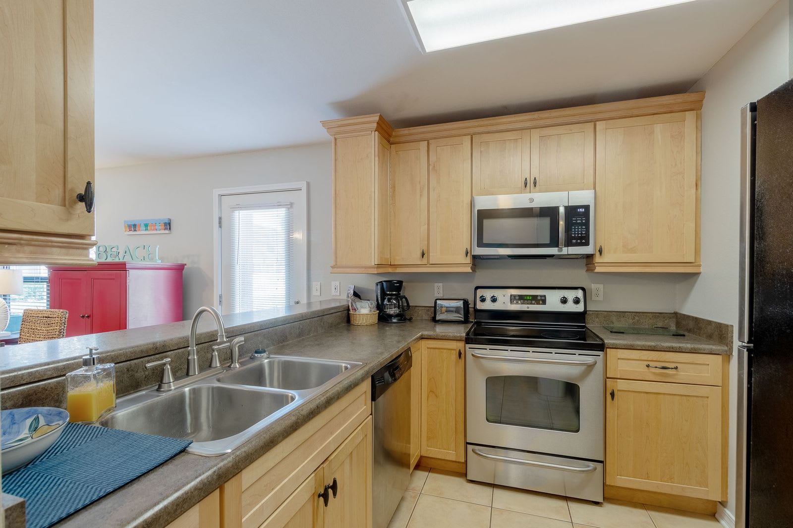 Kitchen has stainless steel appliances and all cooking items you would need!