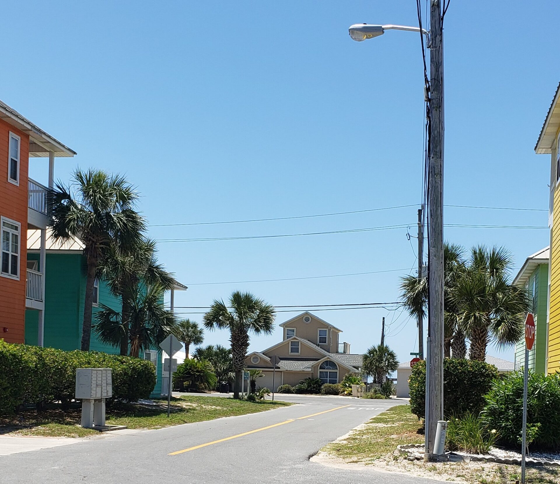 Beach entrance next to 2 story house. View from our yard, Beach is that CLOSE!!