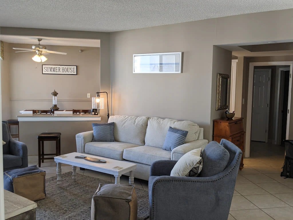 Living room looking into entrance master bedroom and bath