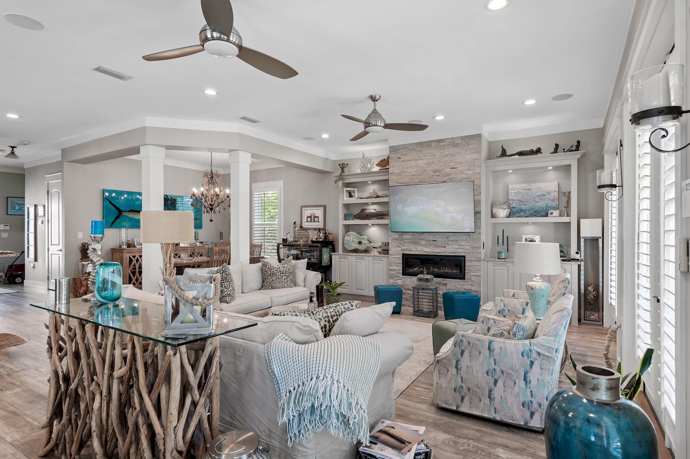 Living room includes two couches (one pull-out bed), two swivel chairs, smartTV