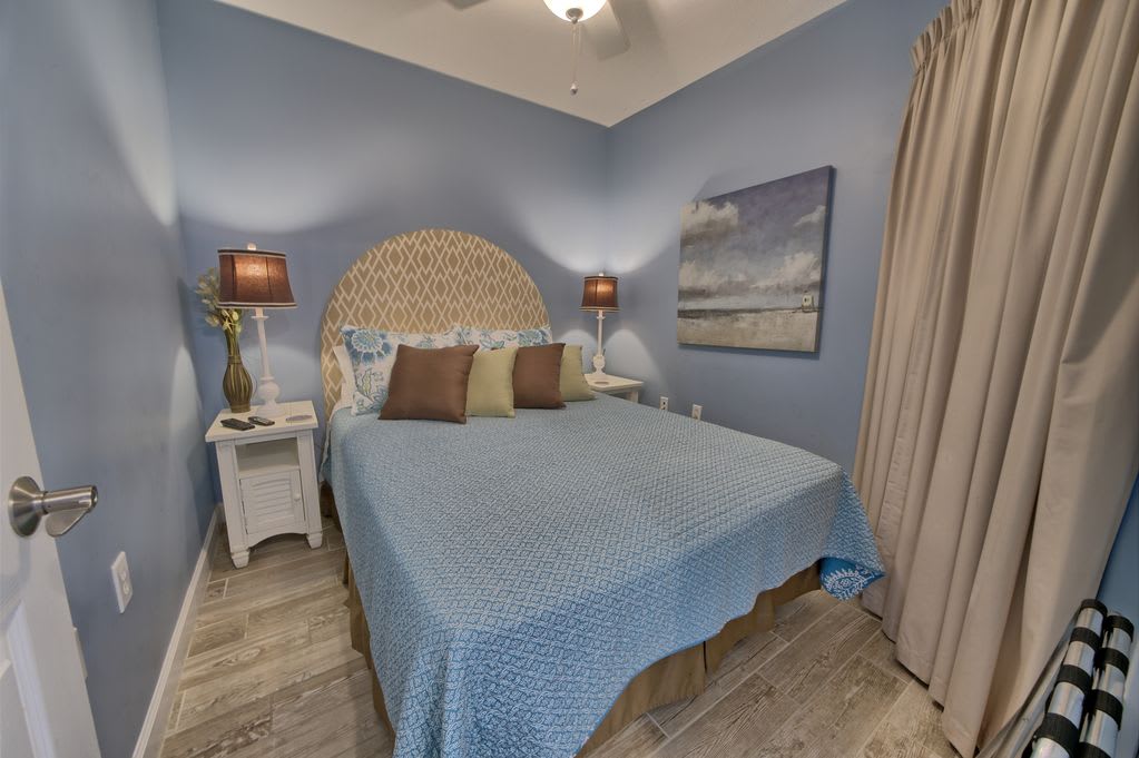 Queen bed in the second bedroom!  Room darkening curtains!