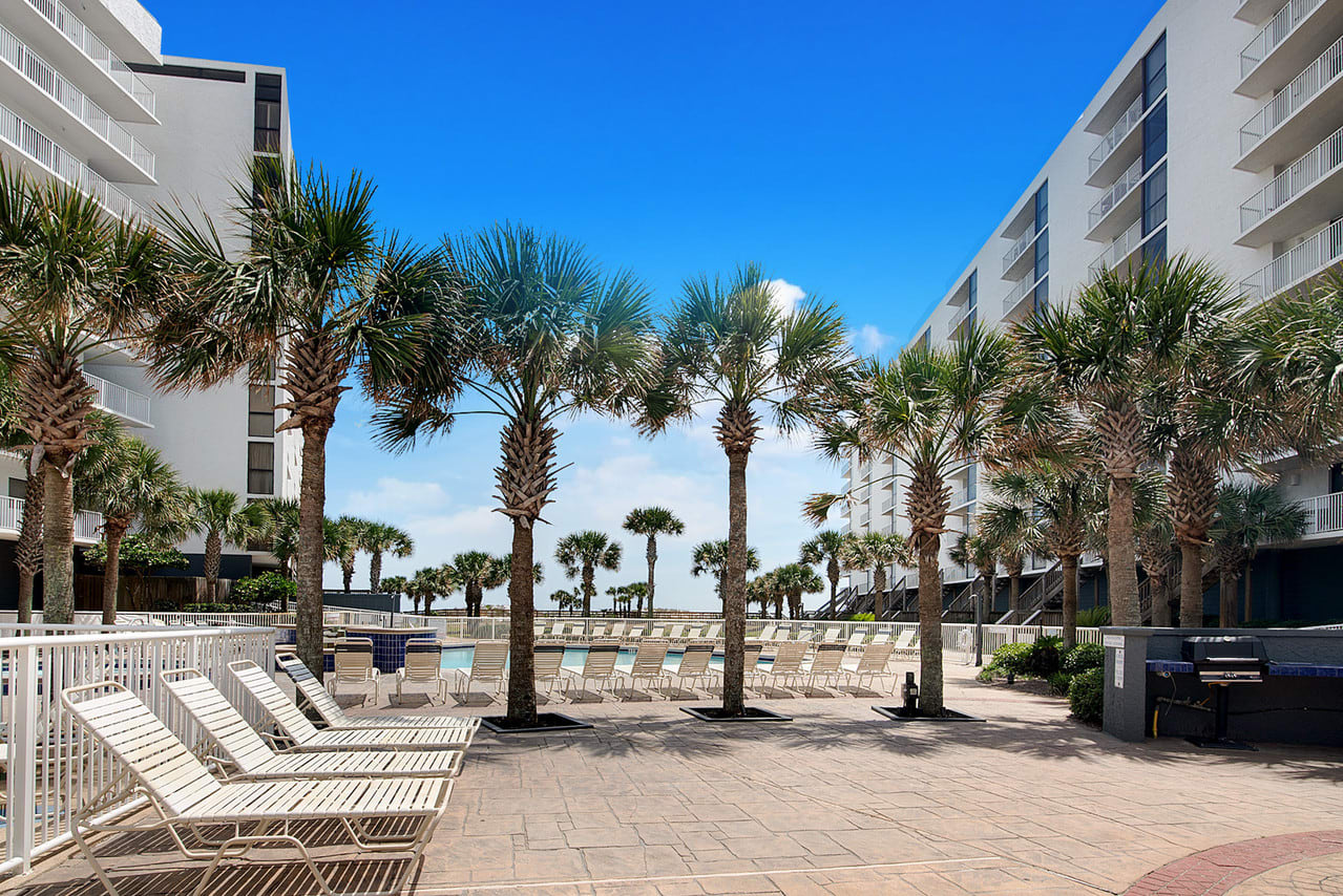 Large pool area with hot tub and kiddie pool.