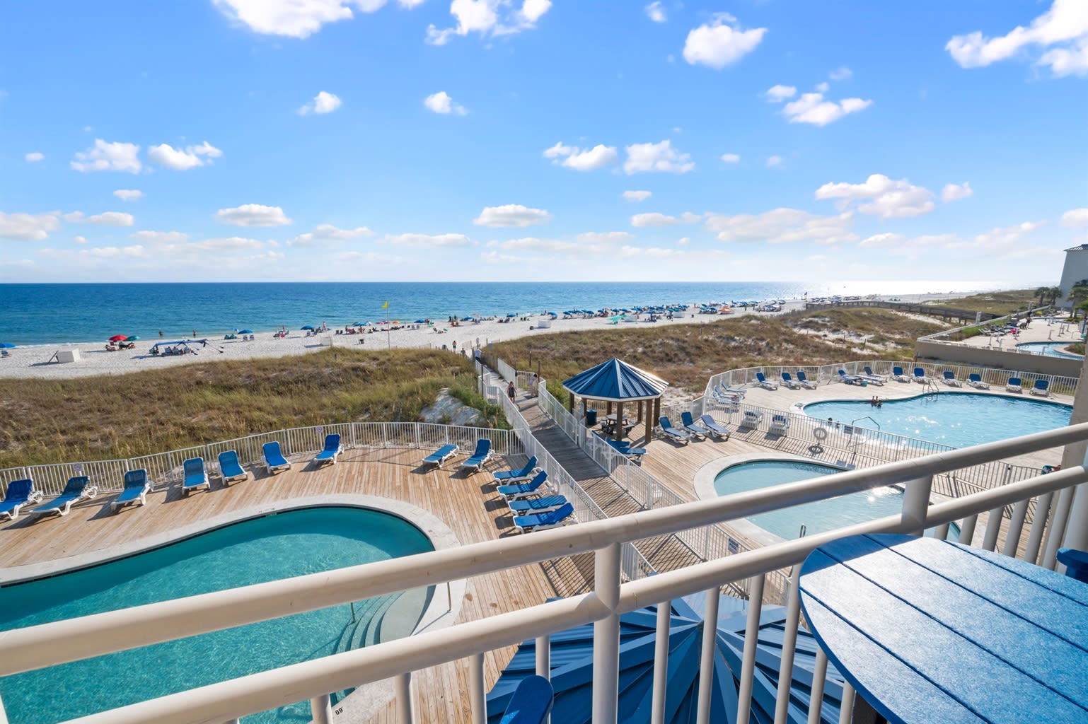 View of 2 pools, kiddie pool, and beach from your balcony