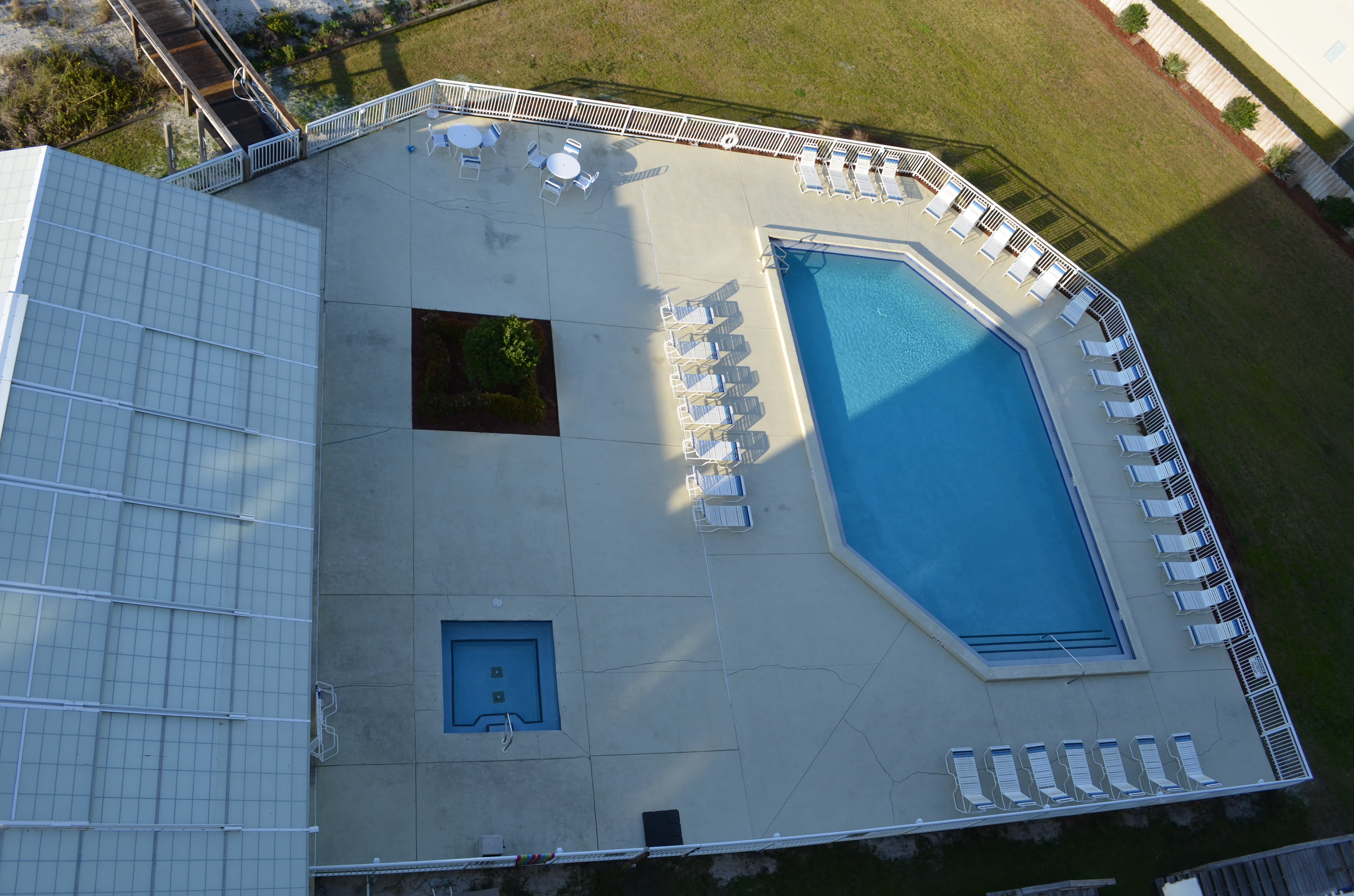 Outdoor pool and hot tub view from Condo 906