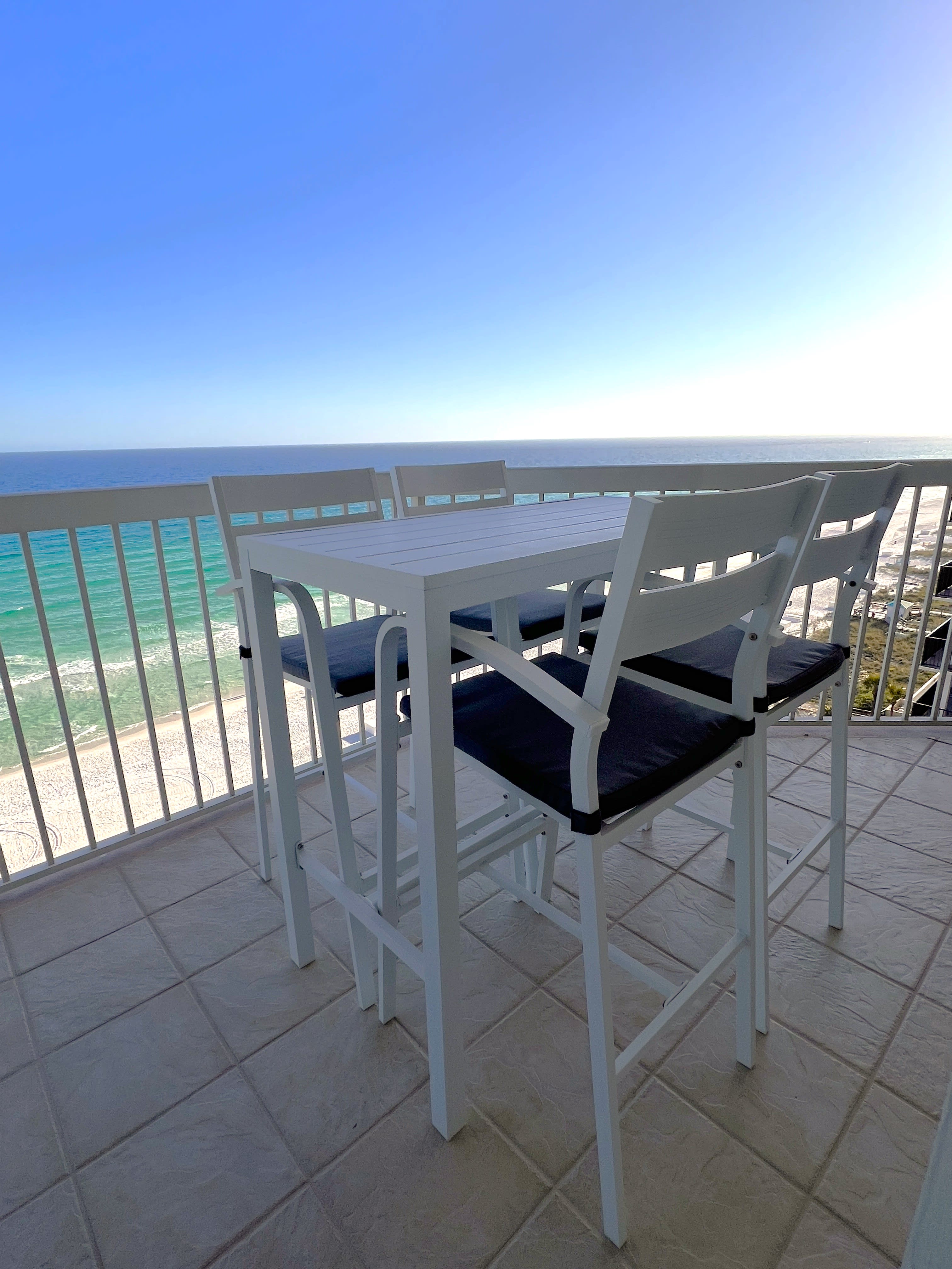 Gulfside balcony dining table and chairs.  