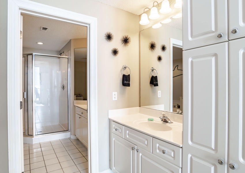Spacious master bath with His and Her sinks with walk in shower. 