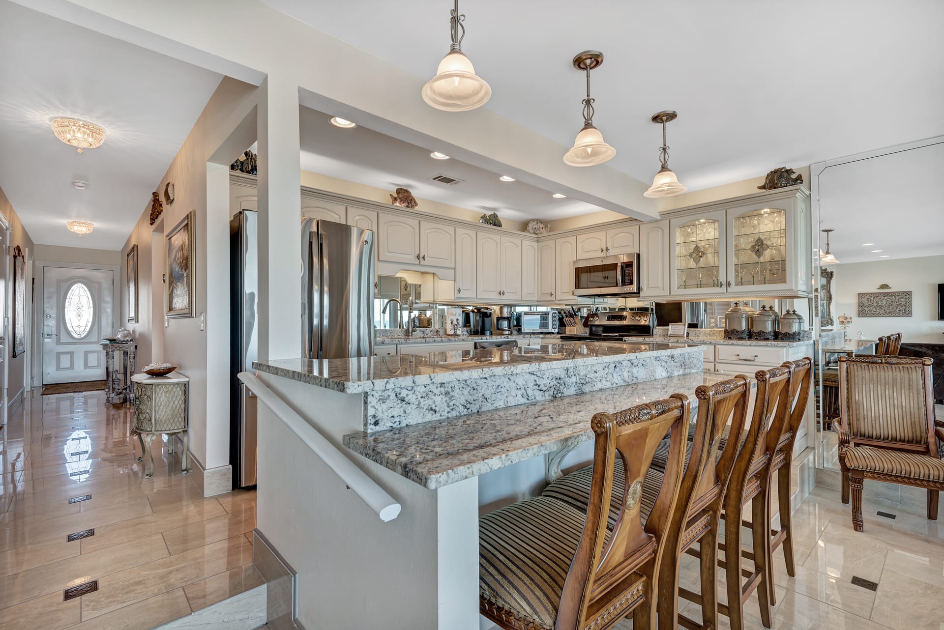 Kitchen with all Stainless Steel Appliances, Eating Bar and Granite Counters