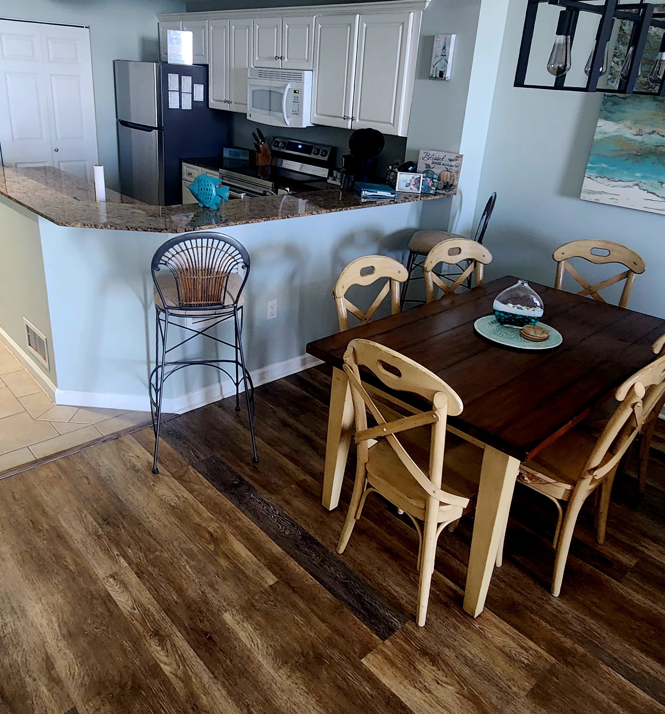 Fully stocked kitchen and dining area with direct Gulf view.