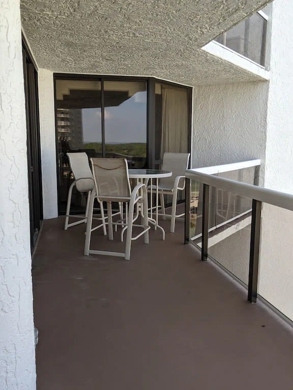 Balcony with seating arrangement and grand skyline