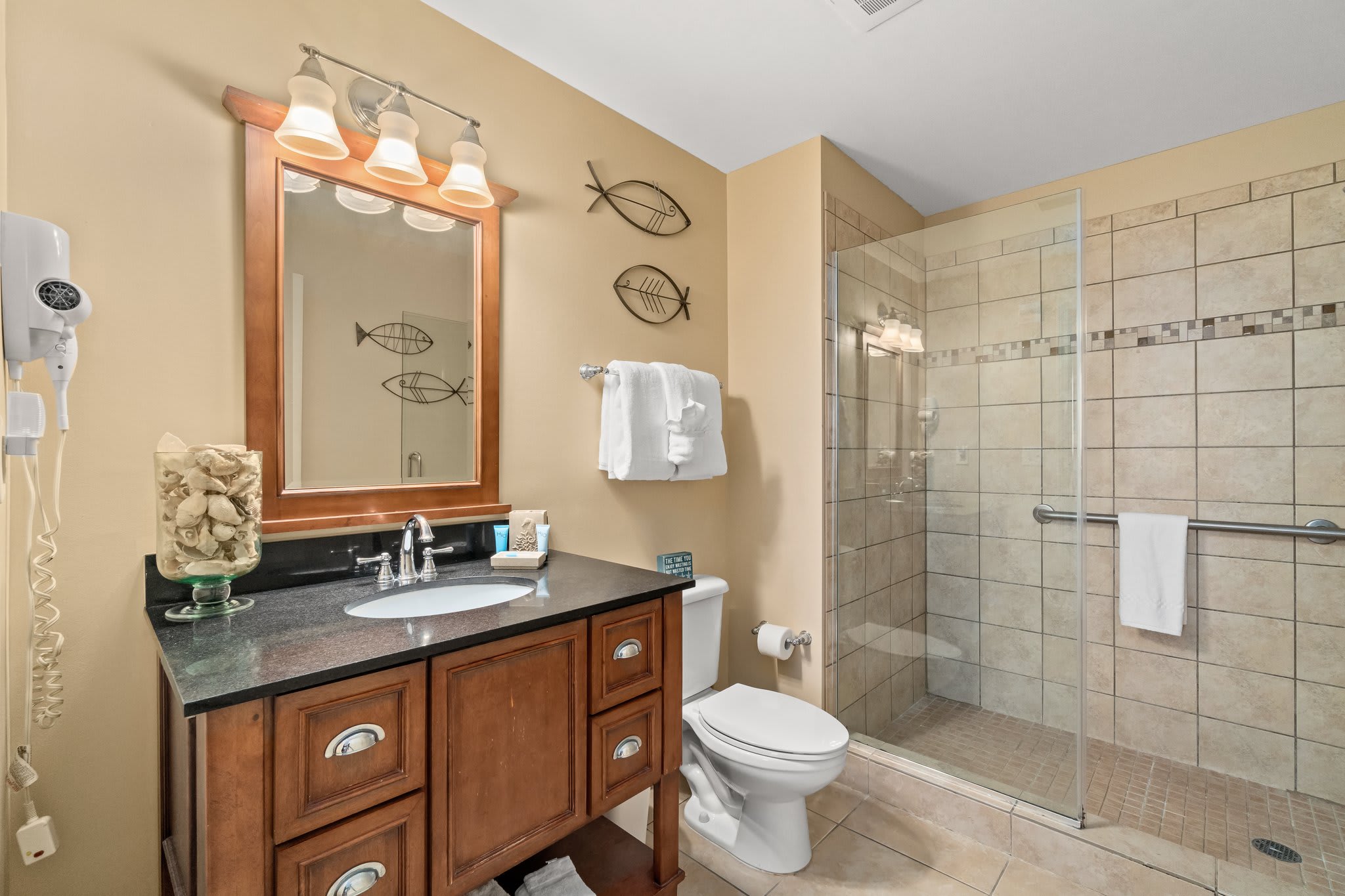 Bathroom with walk in shower and vanity.