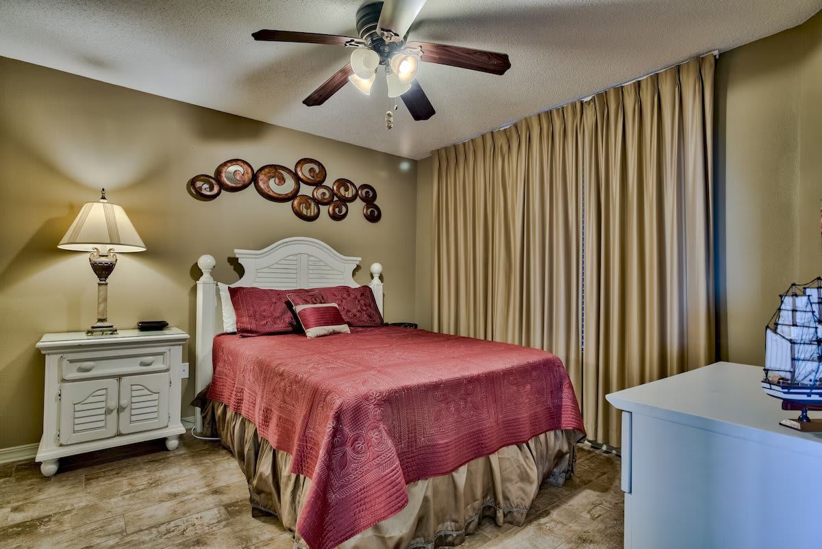 Second bedroom with queen bed and 4" memory foam topper