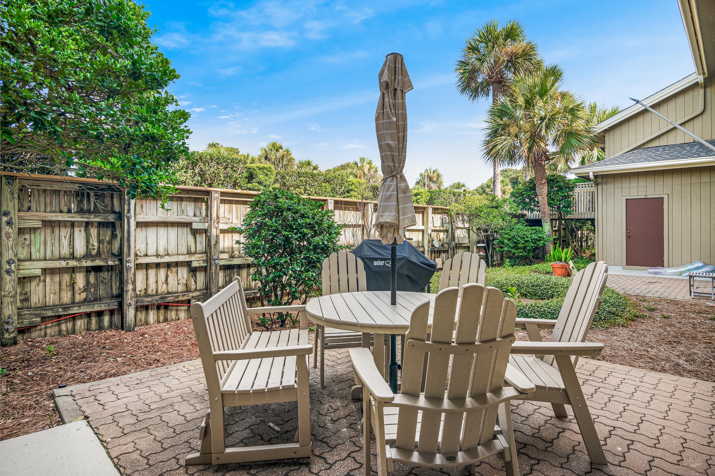 Condo's courtyard, with dining table and full-size gas grill Condo's courtyard, with dining table and full-size gas grill