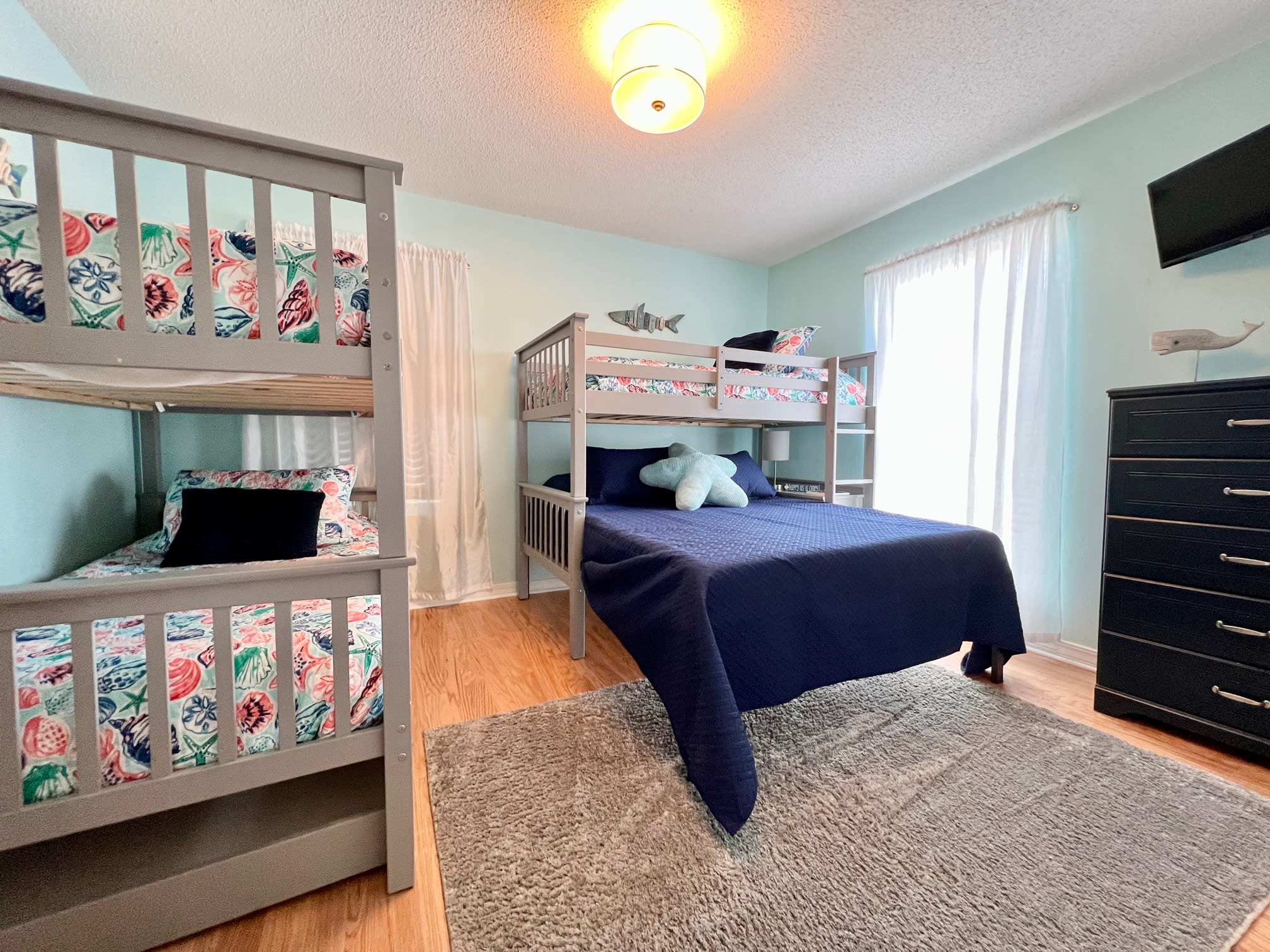 The bunk room can sleep 4-5 comfortably with 3 twins and 1 queen bed.