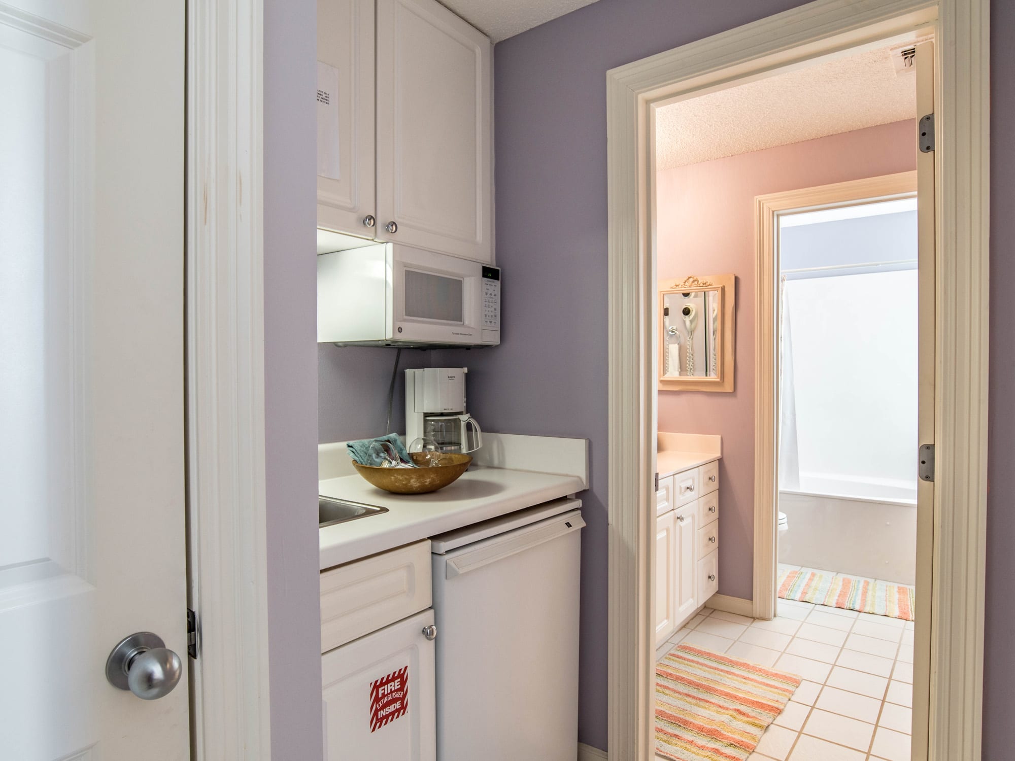 Guest Suite Kitchenette and stacked laundry closet.