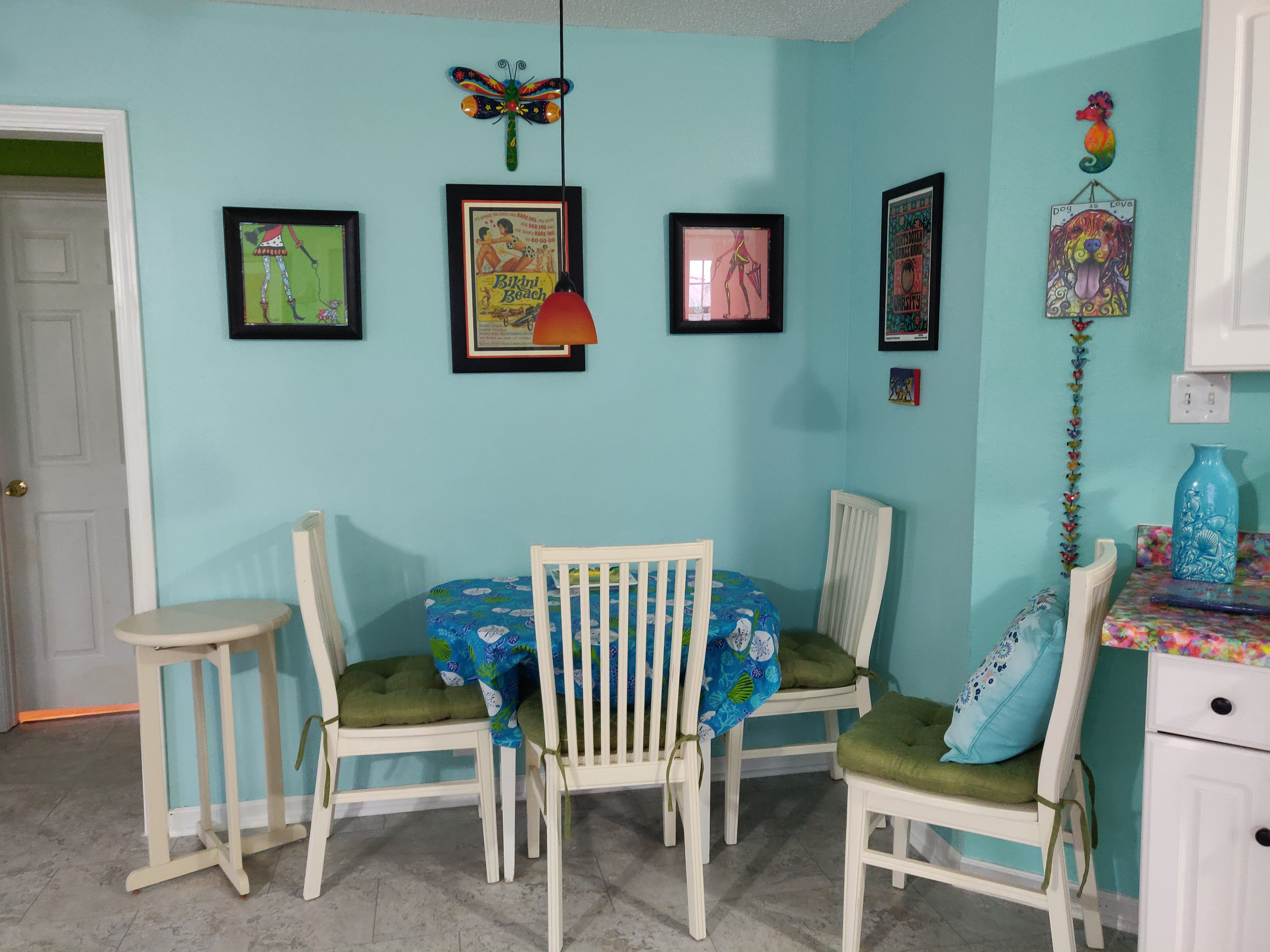 dining area - table folds out into a round, seating for 4.