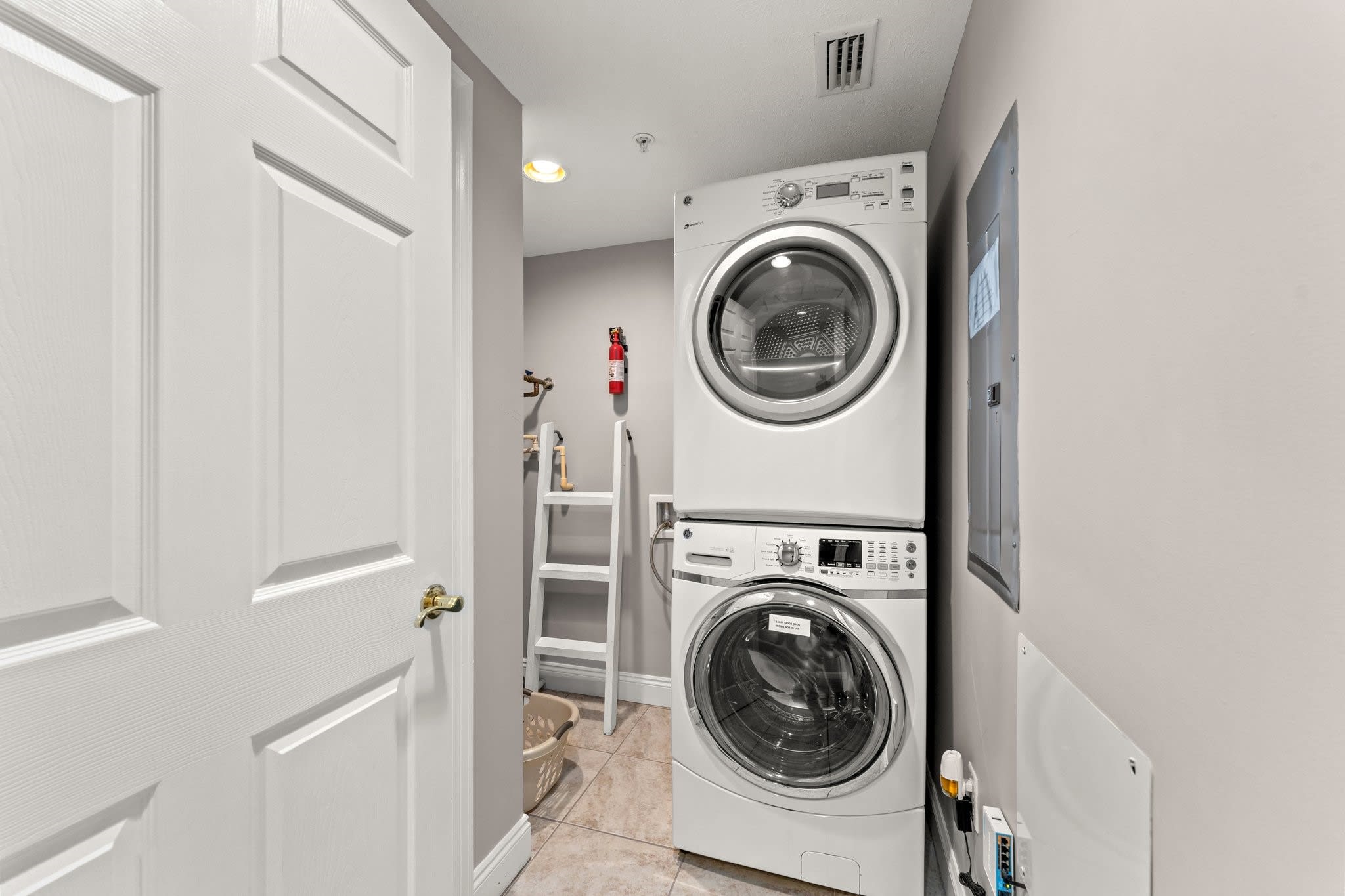 laundry rm with full sized washer and dryer