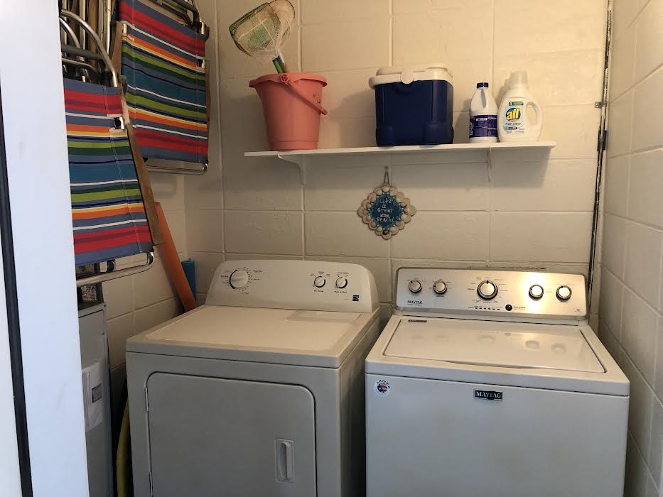 The laundry room has a full size washer/dryer. Beach essentials also stored here