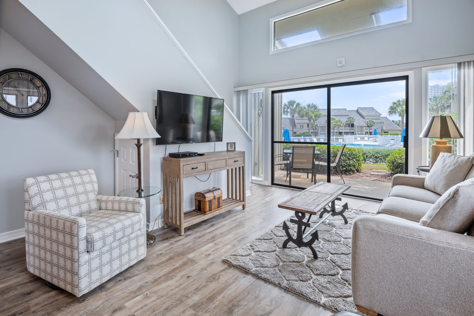 Ground floor end unit has walk out to pool