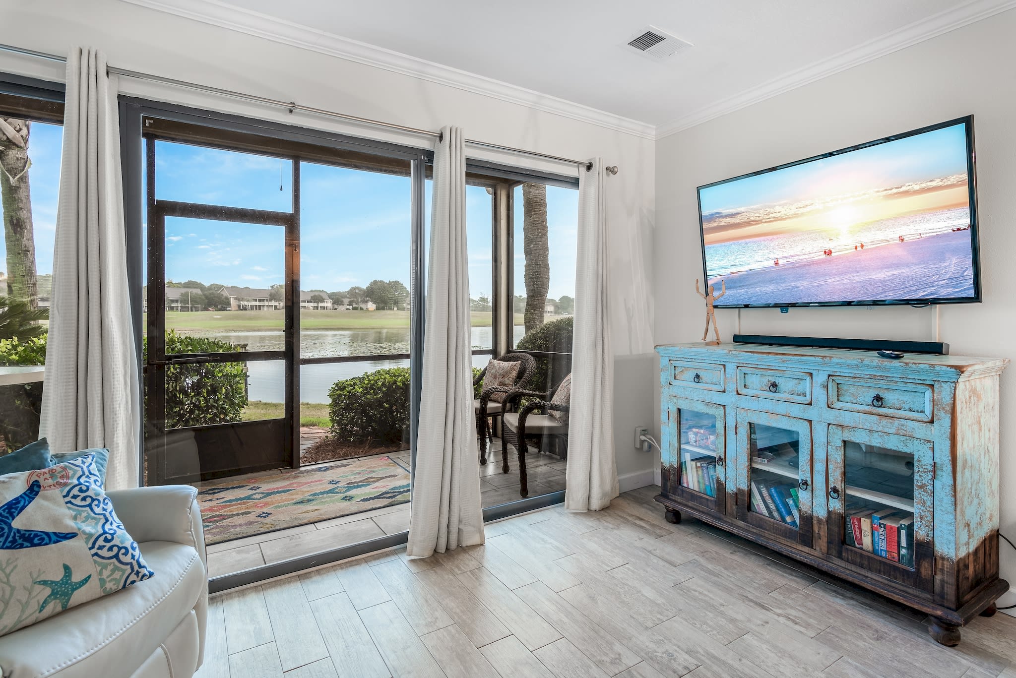 Living area leads out to screened in patio