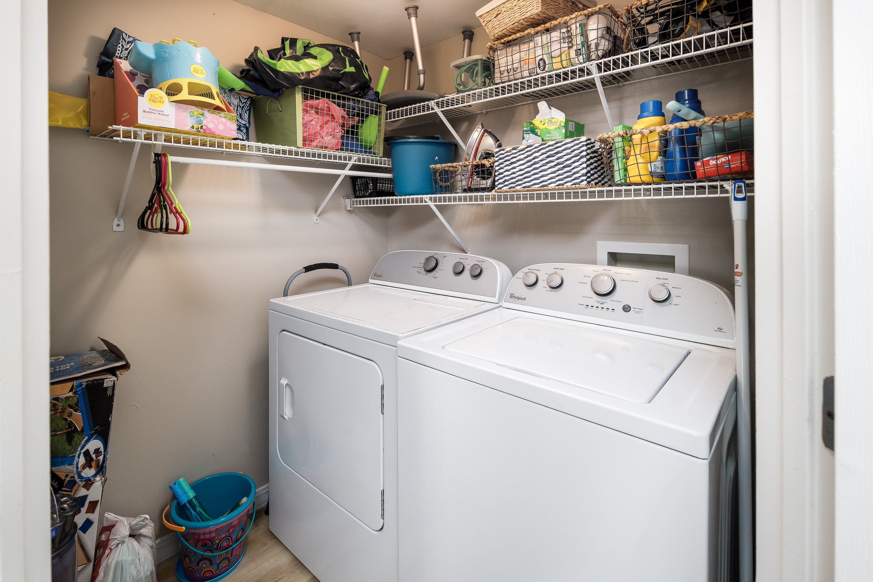 Laundry room with beach toys
